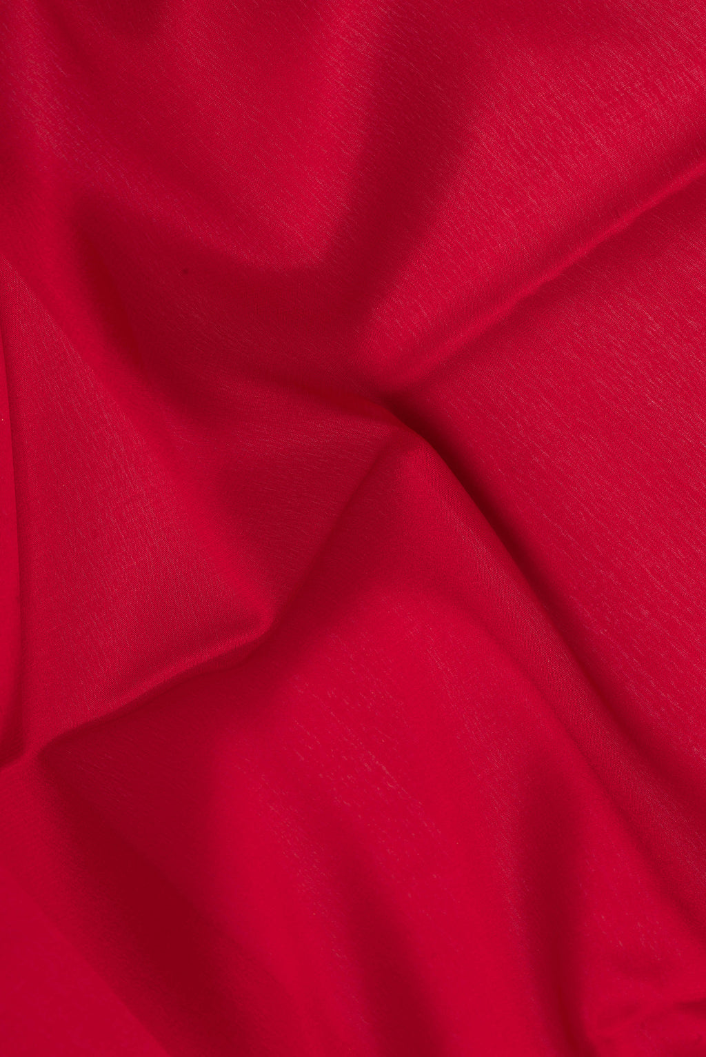 Close up of Red Mysore Silk Saree with Plain Body and Zari Border.  displaying folds