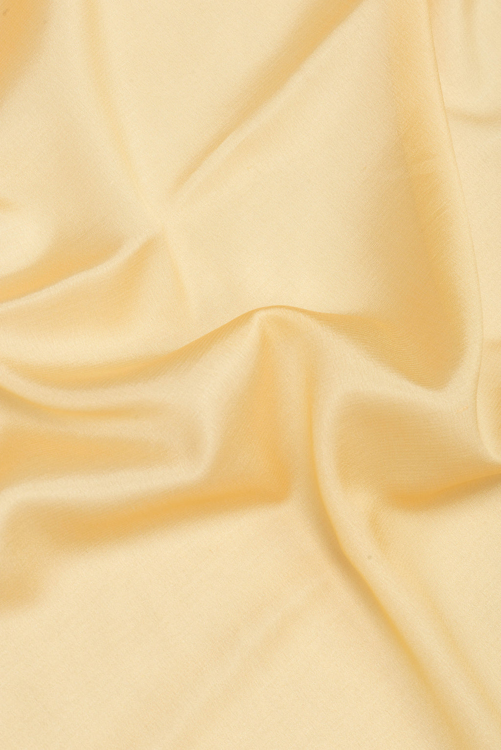 Close up of Sandal Mysore Silk Saree with Plain Body and Zari Border.  displaying folds