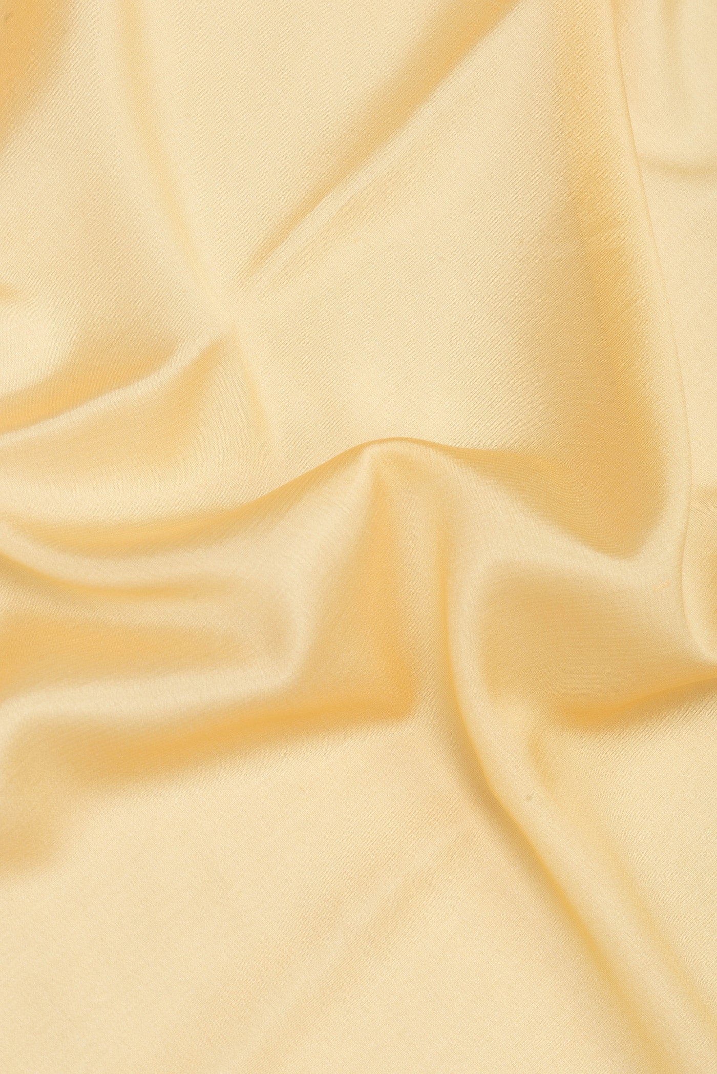 Close up of Sandal Mysore Silk Saree with Plain Body and Zari Border.  displaying folds