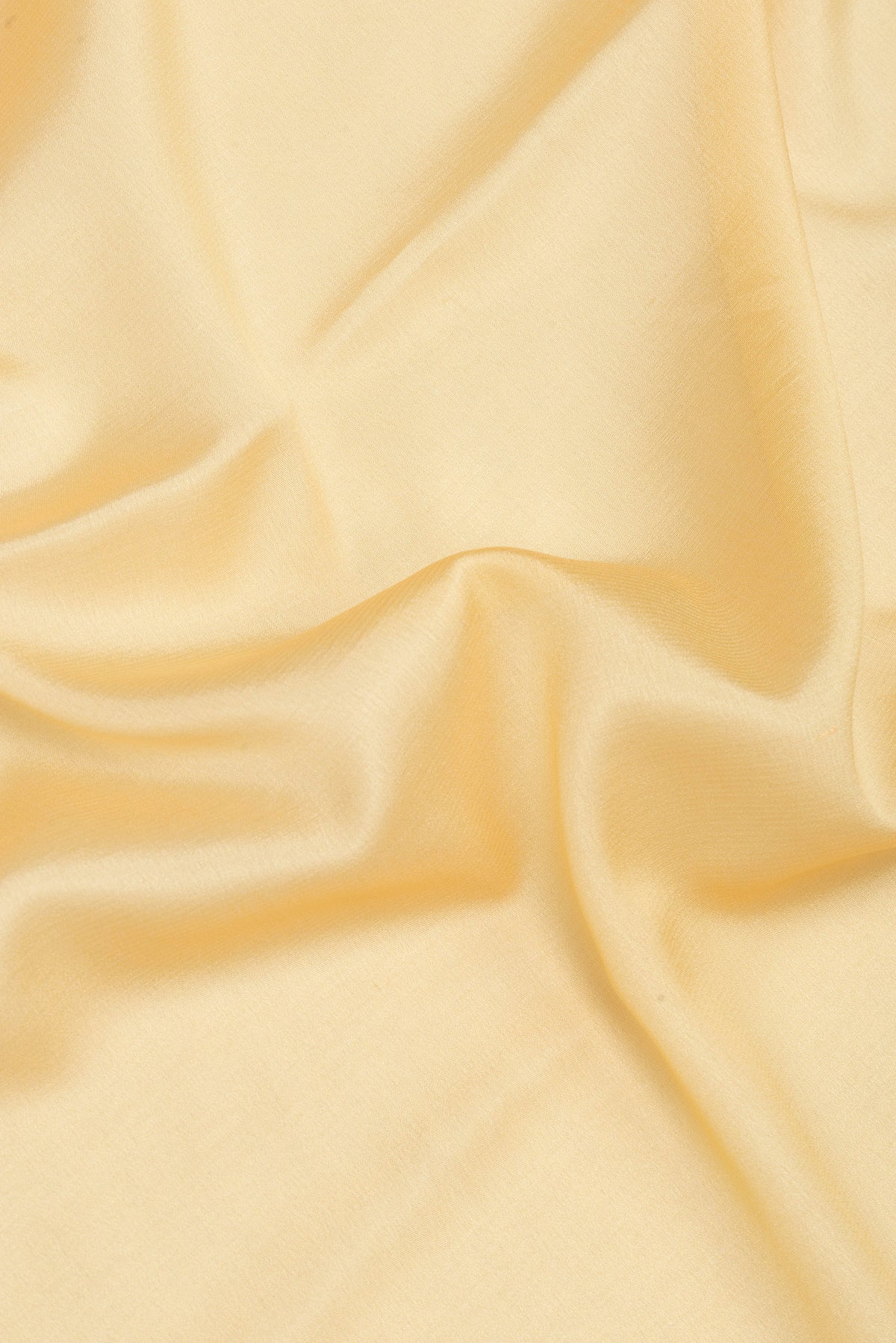 Close up of Sandal Mysore Silk Saree with Plain Body and Zari Border.  displaying folds