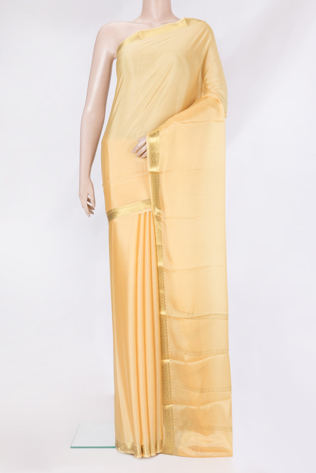 Sandal Mysore Silk Saree with Plain Body and Zari Border.  displayed on a mannequin