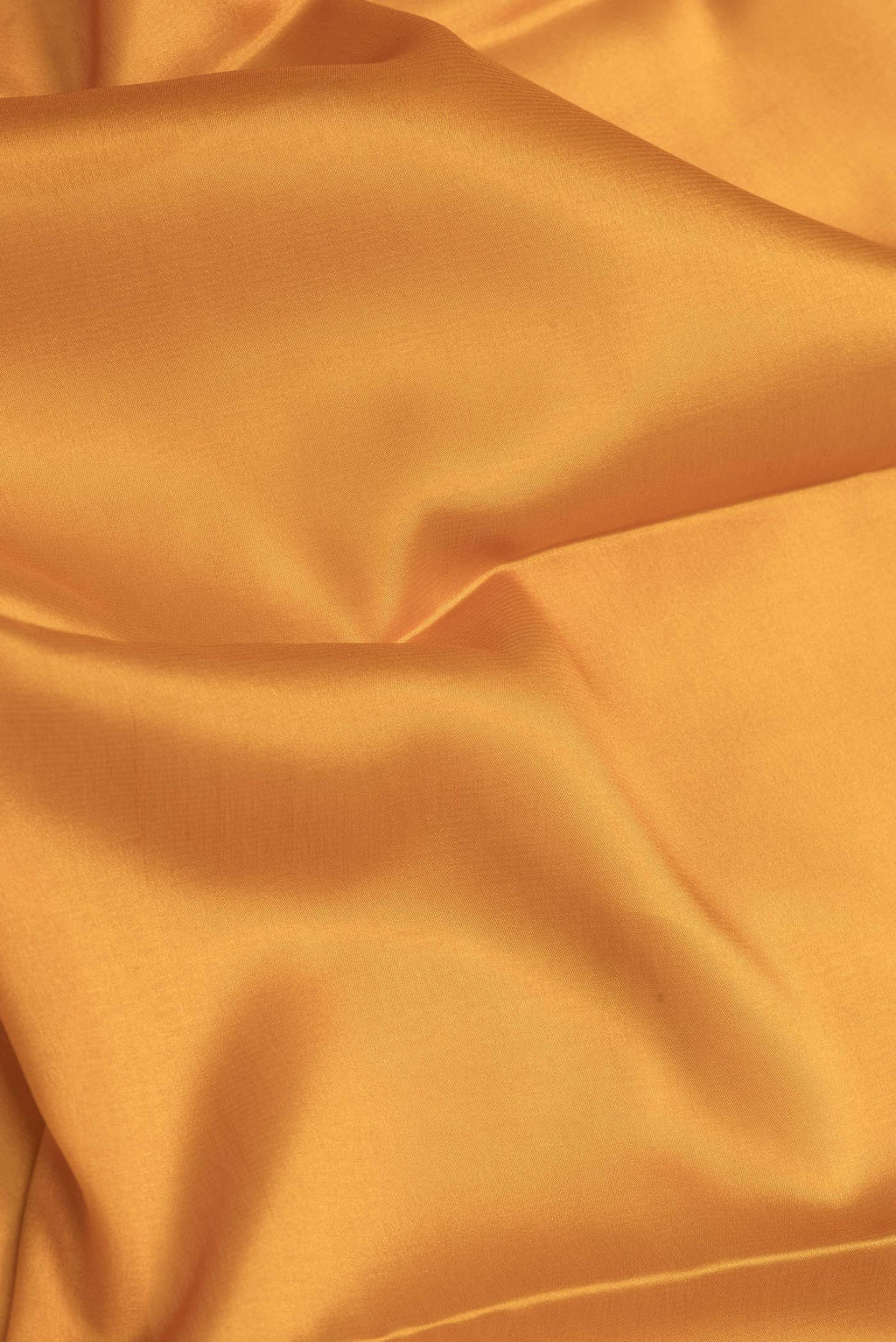 Close up of Mustard Dual Tone Mysore Silk Saree with Plain Body and Zari Border.  displaying folds