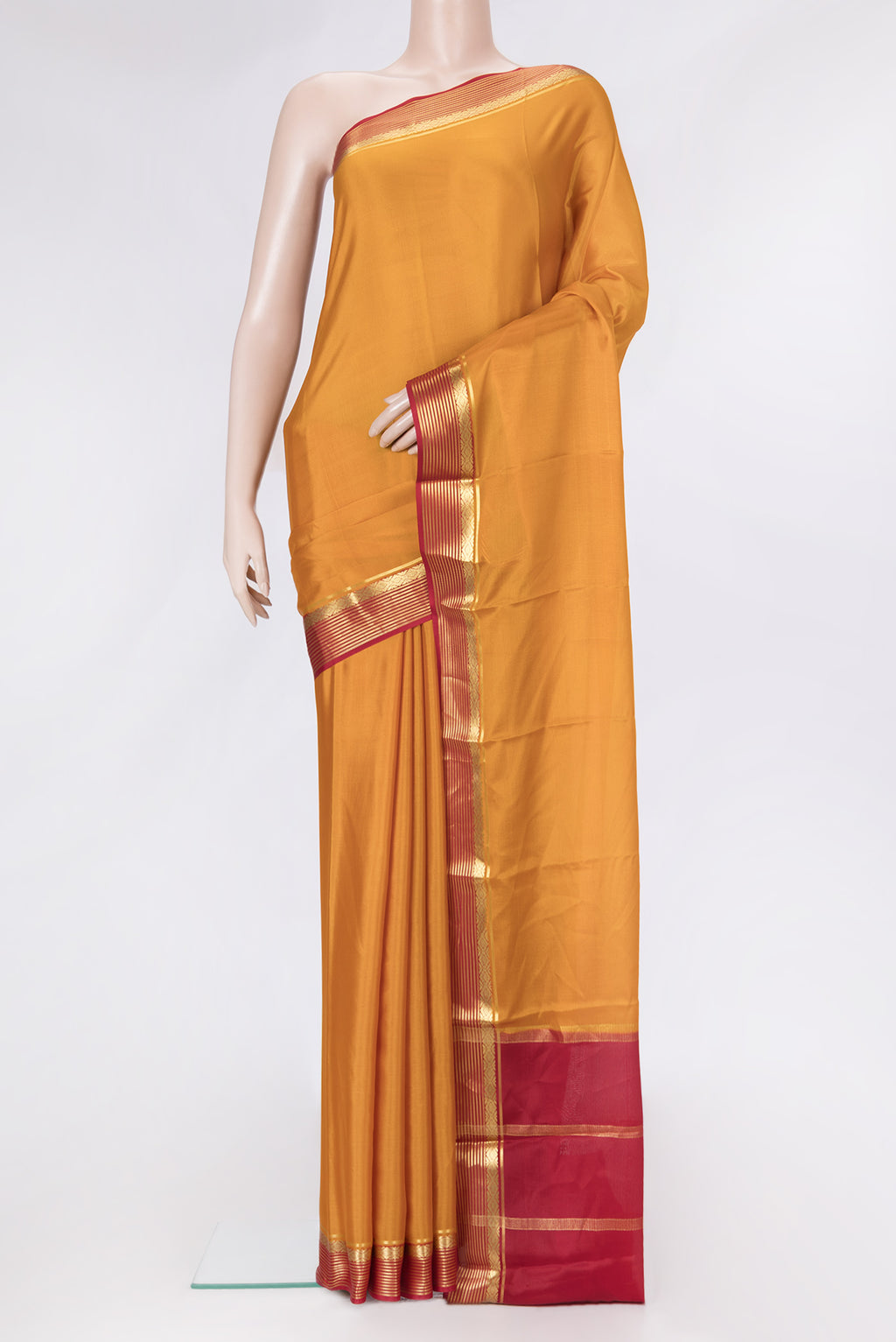 Mustard Dual Tone Mysore Silk Saree with Plain Body and Zari Border.  displayed on a mannequin