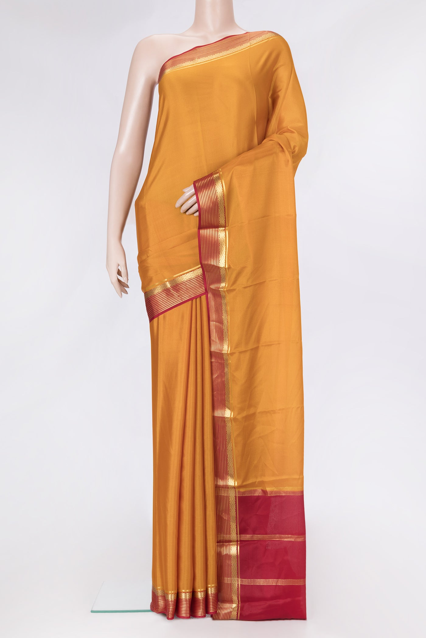 Mustard Dual Tone Mysore Silk Saree with Plain Body and Zari Border.  displayed on a mannequin