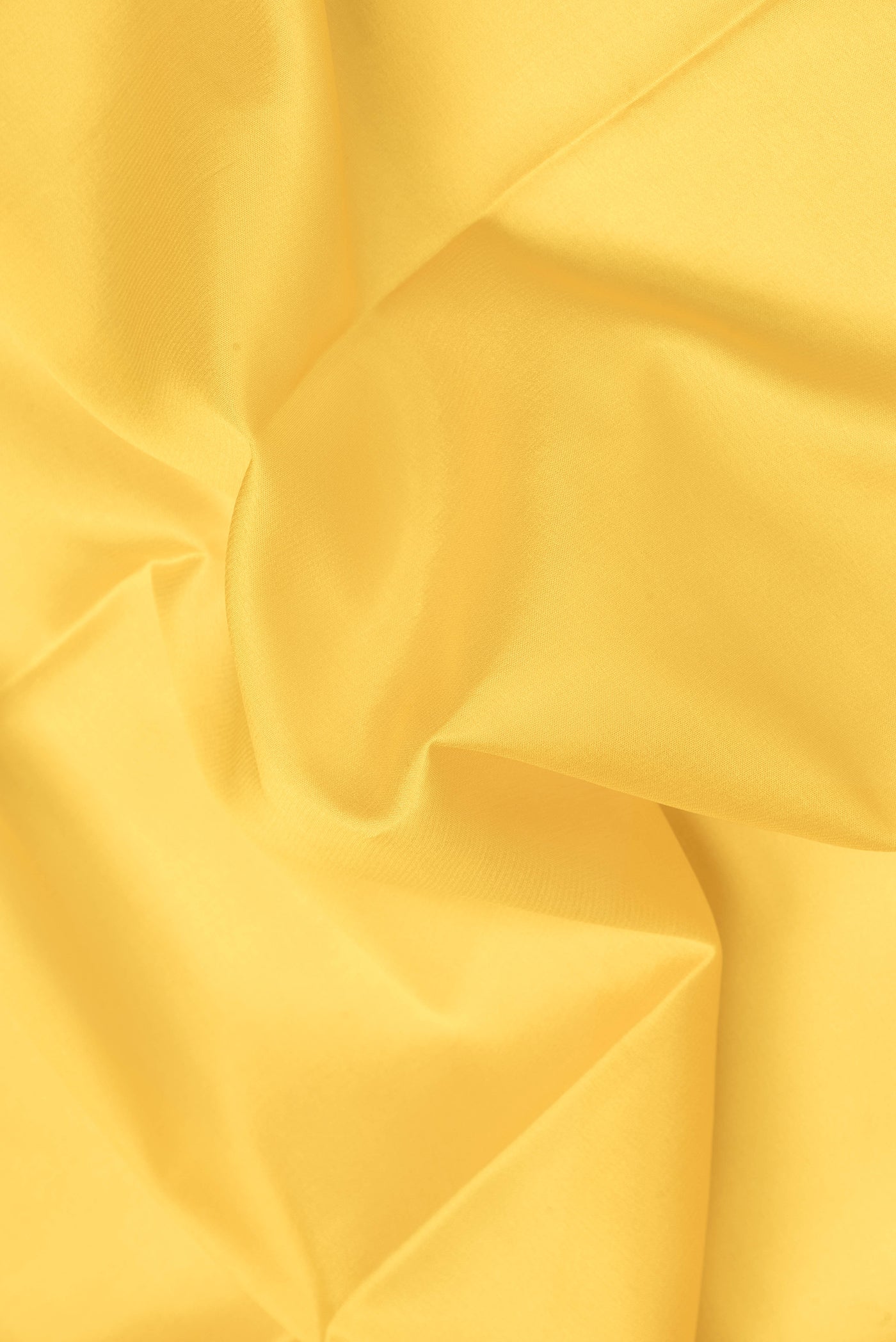 Close up of Yellow Dual Tone Mysore Silk Saree with Plain Body and Zari Border.  displaying folds
