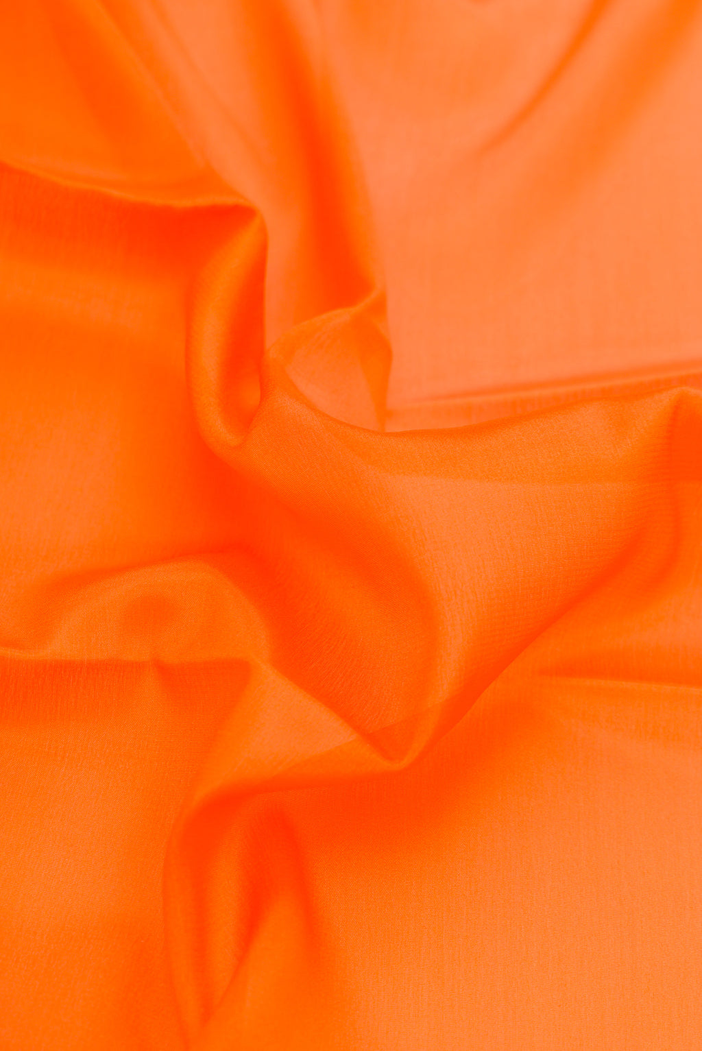 Close up of Orange Dual Tone Mysore Silk Saree with Plain Body and Zari Border.  displaying folds