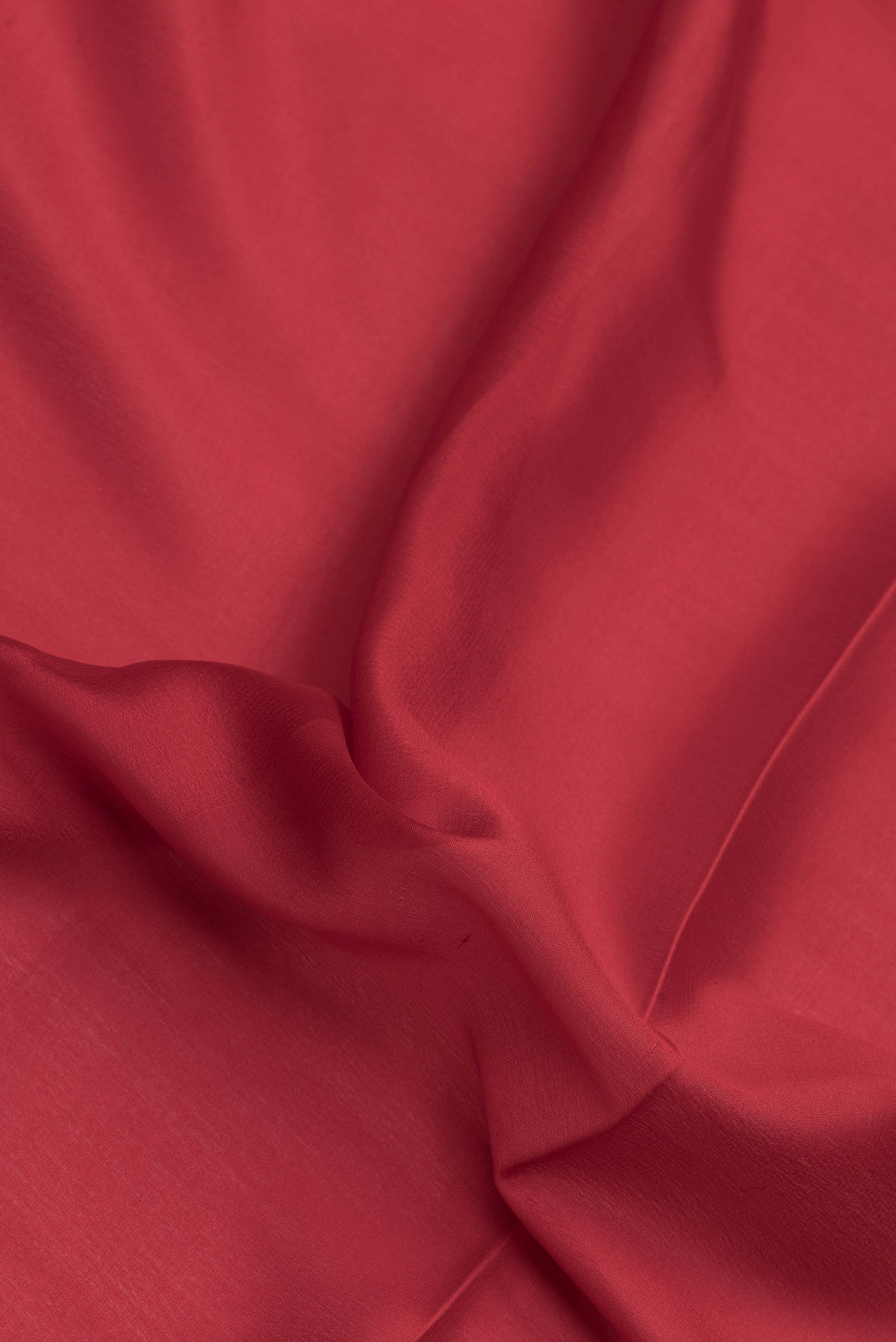 Close up of Red Dual Tone Mysore Silk Saree with Plain Body and Zari Border.  displaying folds