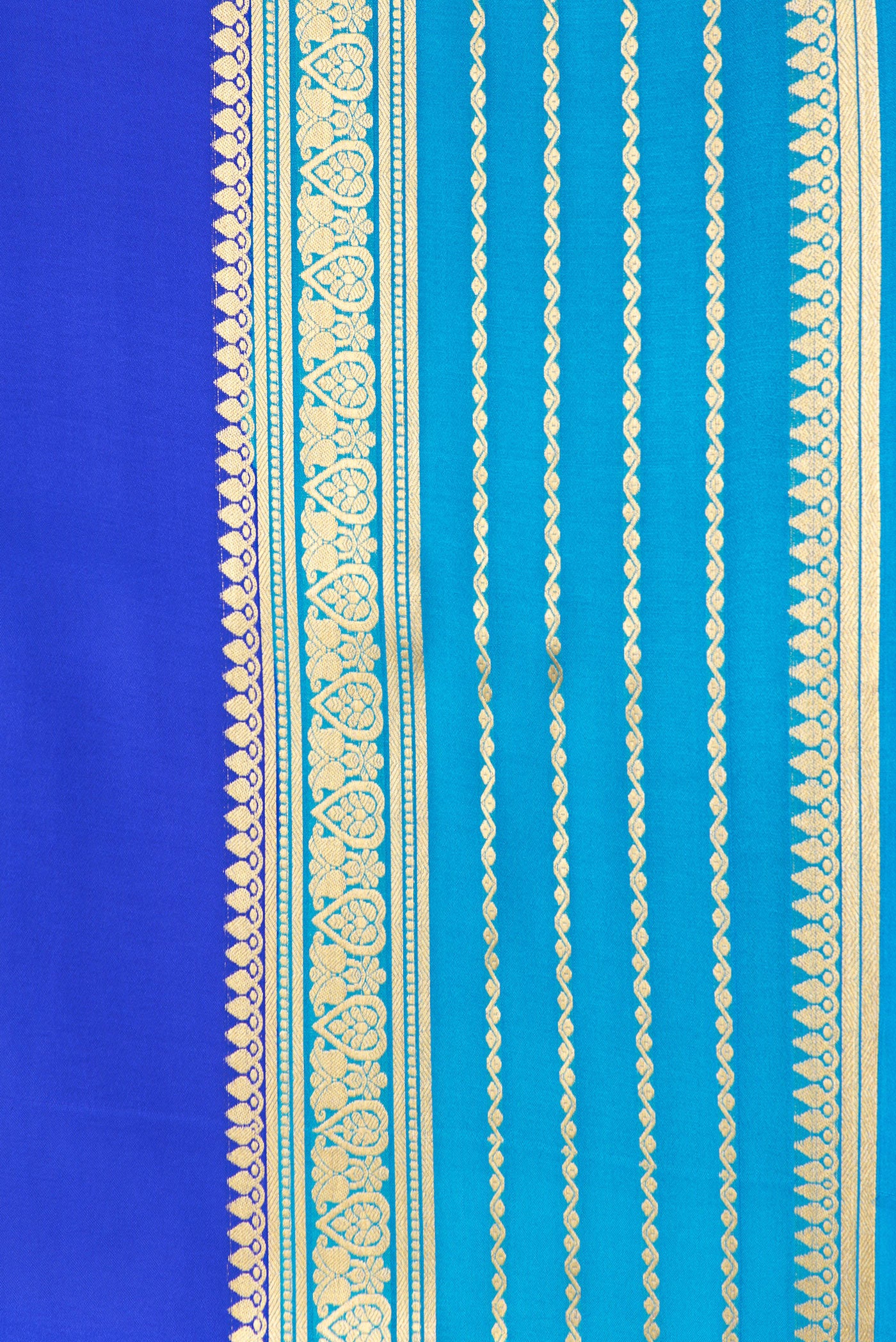 Border image of Royal Blue Dual Tone Mysore Crepe Saree with Plain Body and Zari Border. 