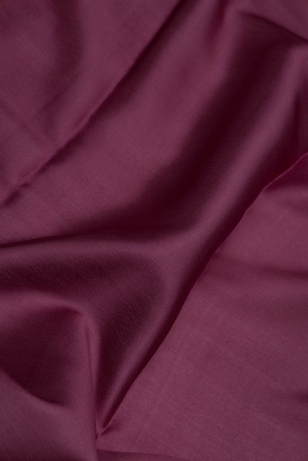 Close up of Burgundy Dual Tone Mysore Silk Saree with Plain Body and Zari Border.  displaying folds