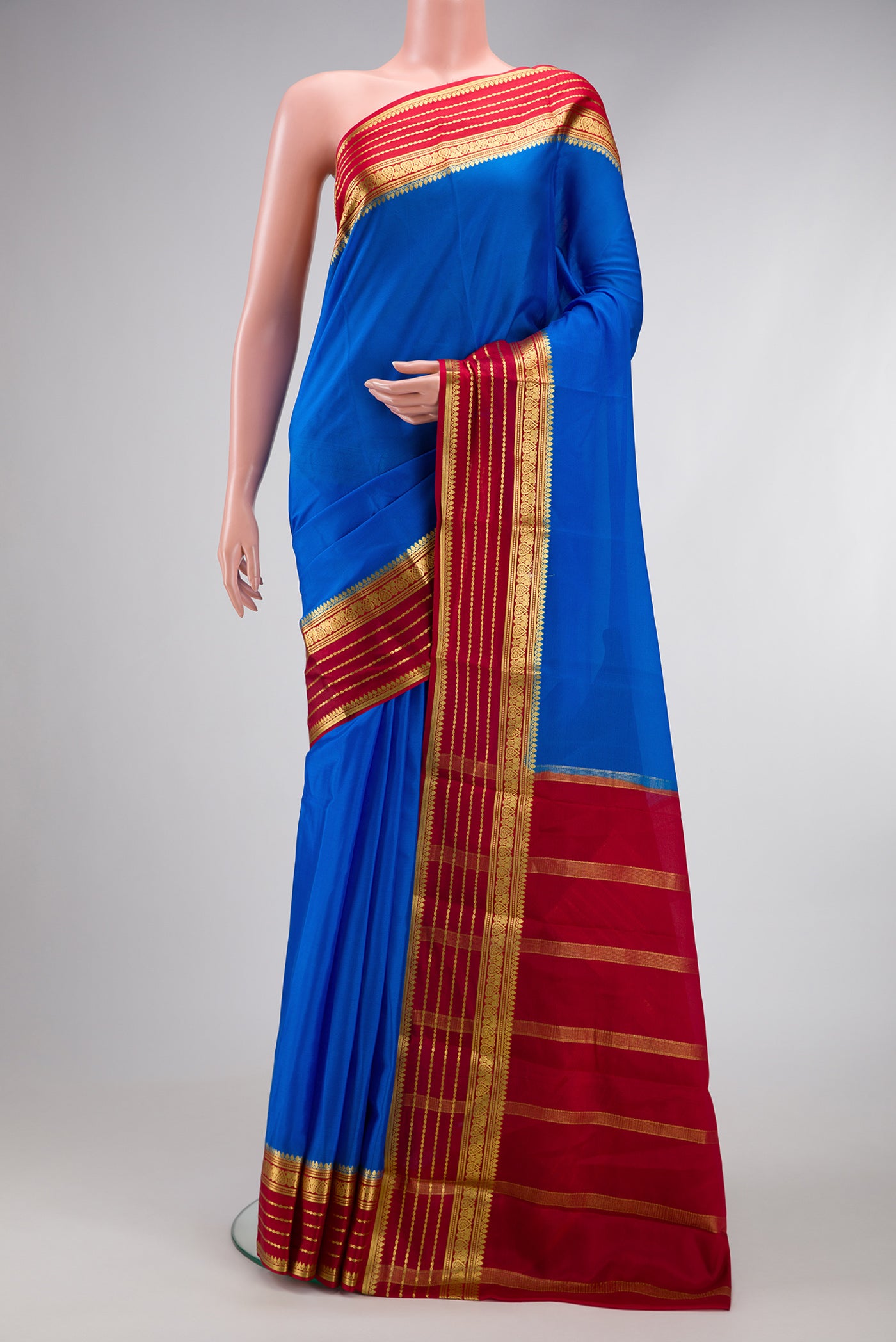 Royal Blue Dual Tone Mysore Silk Saree with Plain Body and Zari Border.  displayed on a mannequin