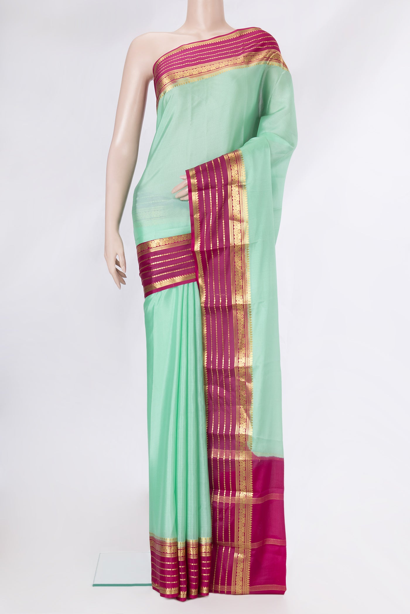 Sea Green Dual Tone Mysore Crepe Saree with Plain Body and Zari Border.  displayed on a mannequin