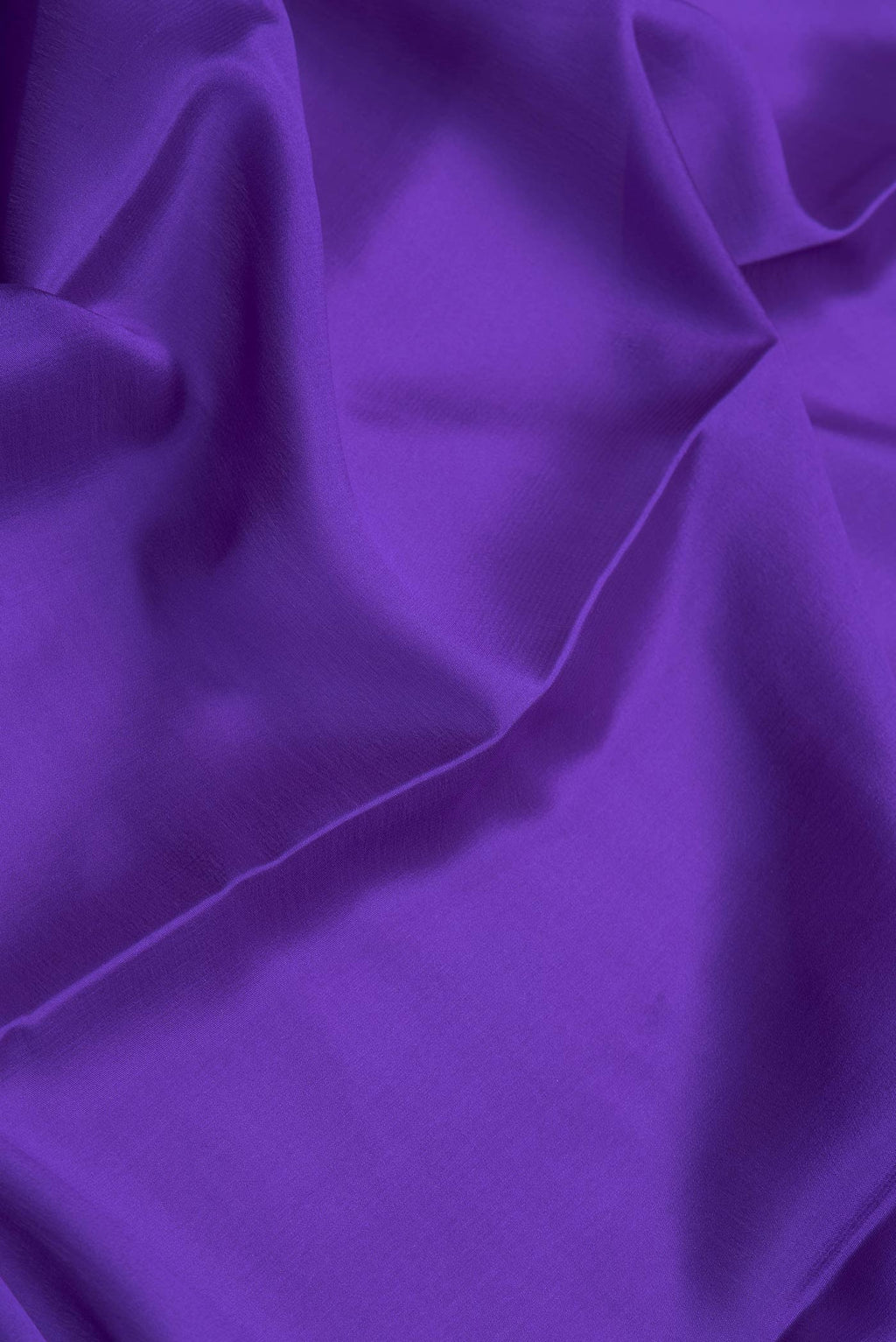 Close up of Royal Blue Dual Tone Mysore Silk Saree with Plain Body and Zari Border.  displaying folds