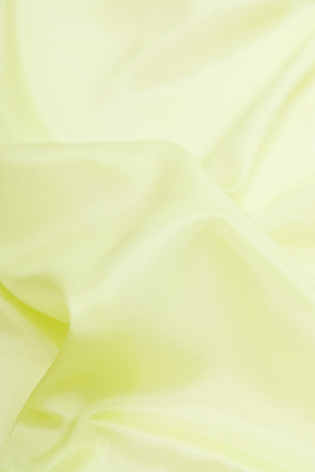 Close up of Pista Green Dual Tone Mysore Silk Saree with Plain Body and Fancy Border.  displaying folds