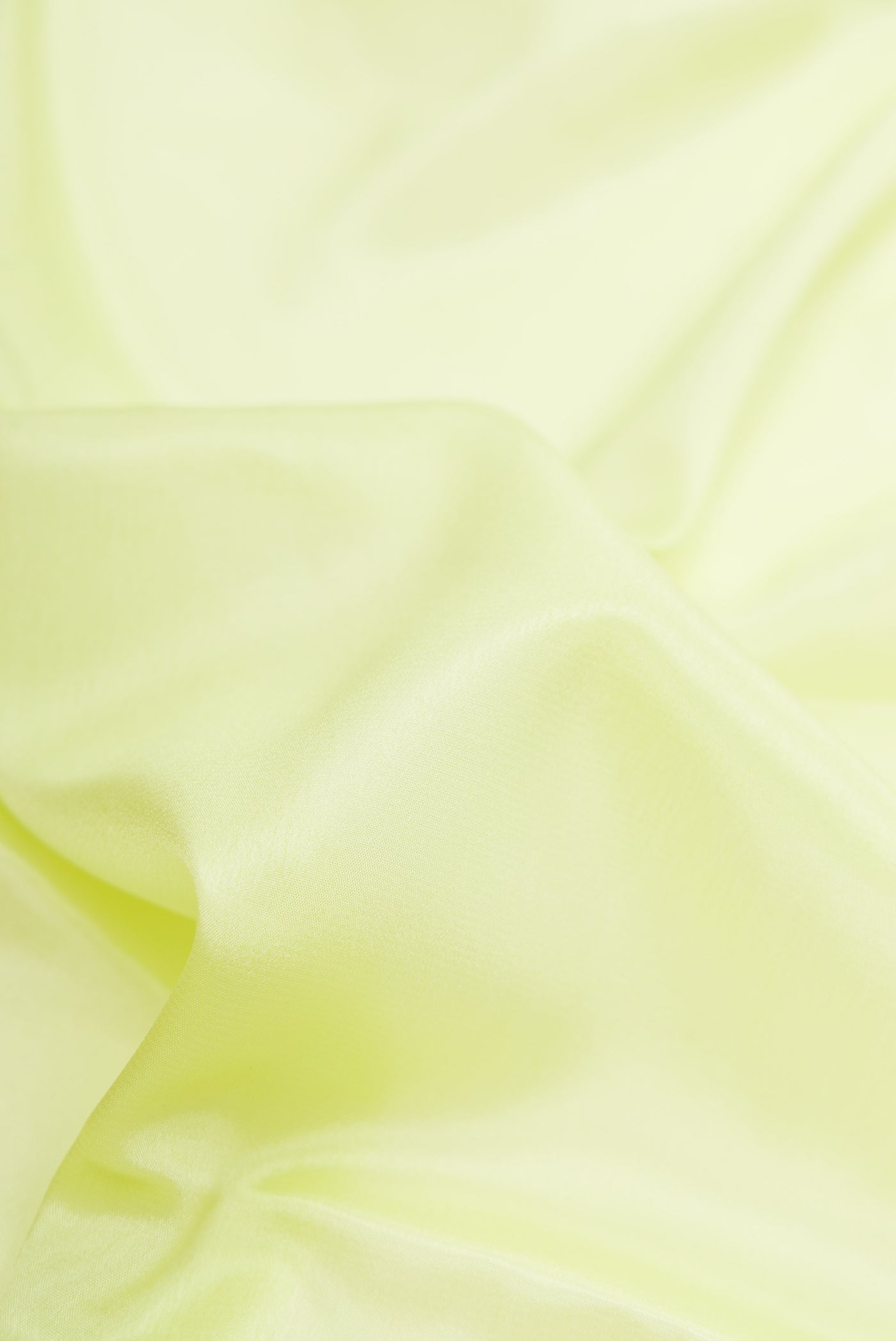 Close up of Pista Green Dual Tone Mysore Silk Saree with Plain Body and Fancy Border.  displaying folds