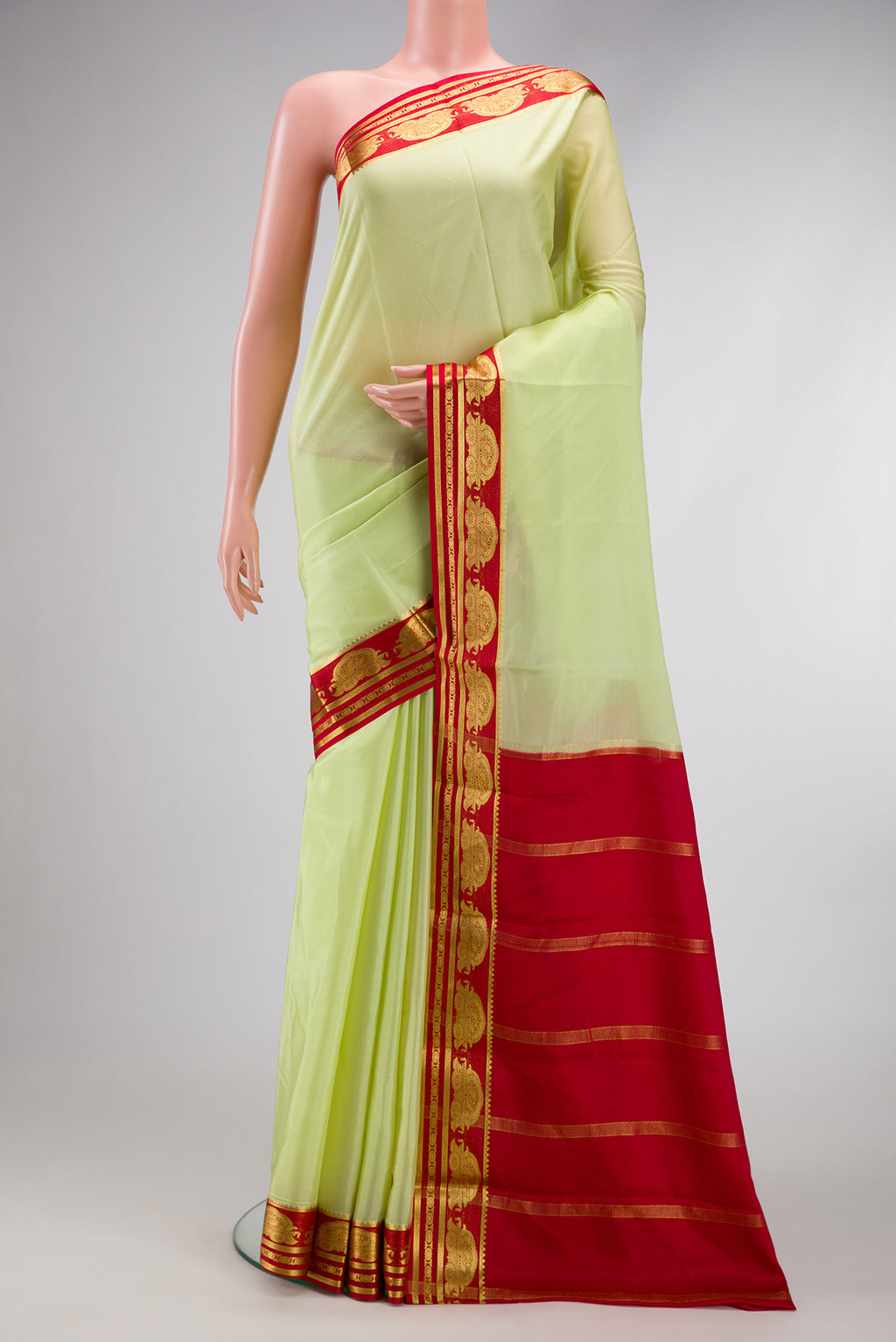 Pista Green Dual Tone Mysore Silk Saree with Plain Body and Fancy Border.  displayed on a mannequin