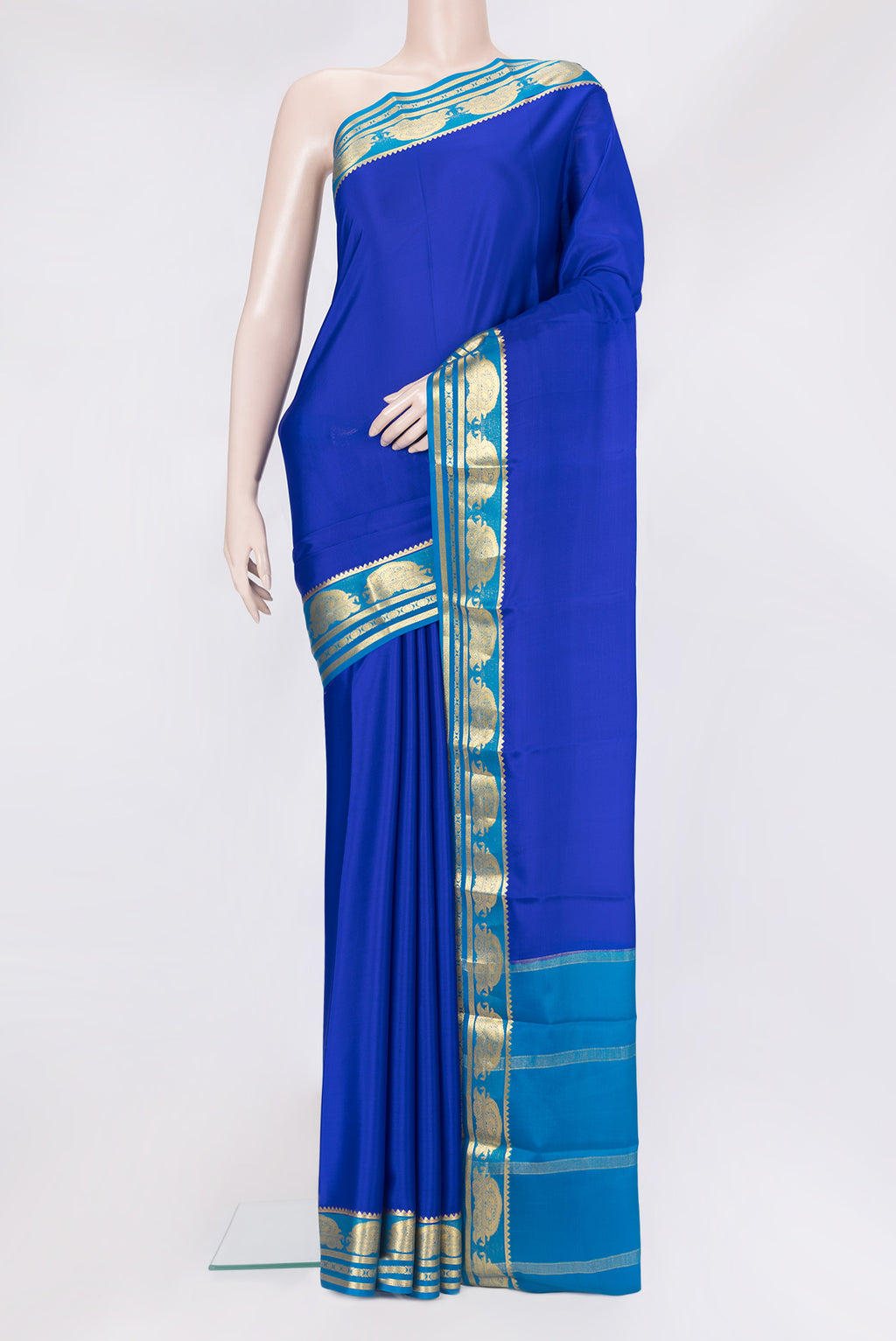 Royal Blue Mysore Crepe Saree with Plain Body and Zari Border.  displayed on a mannequin