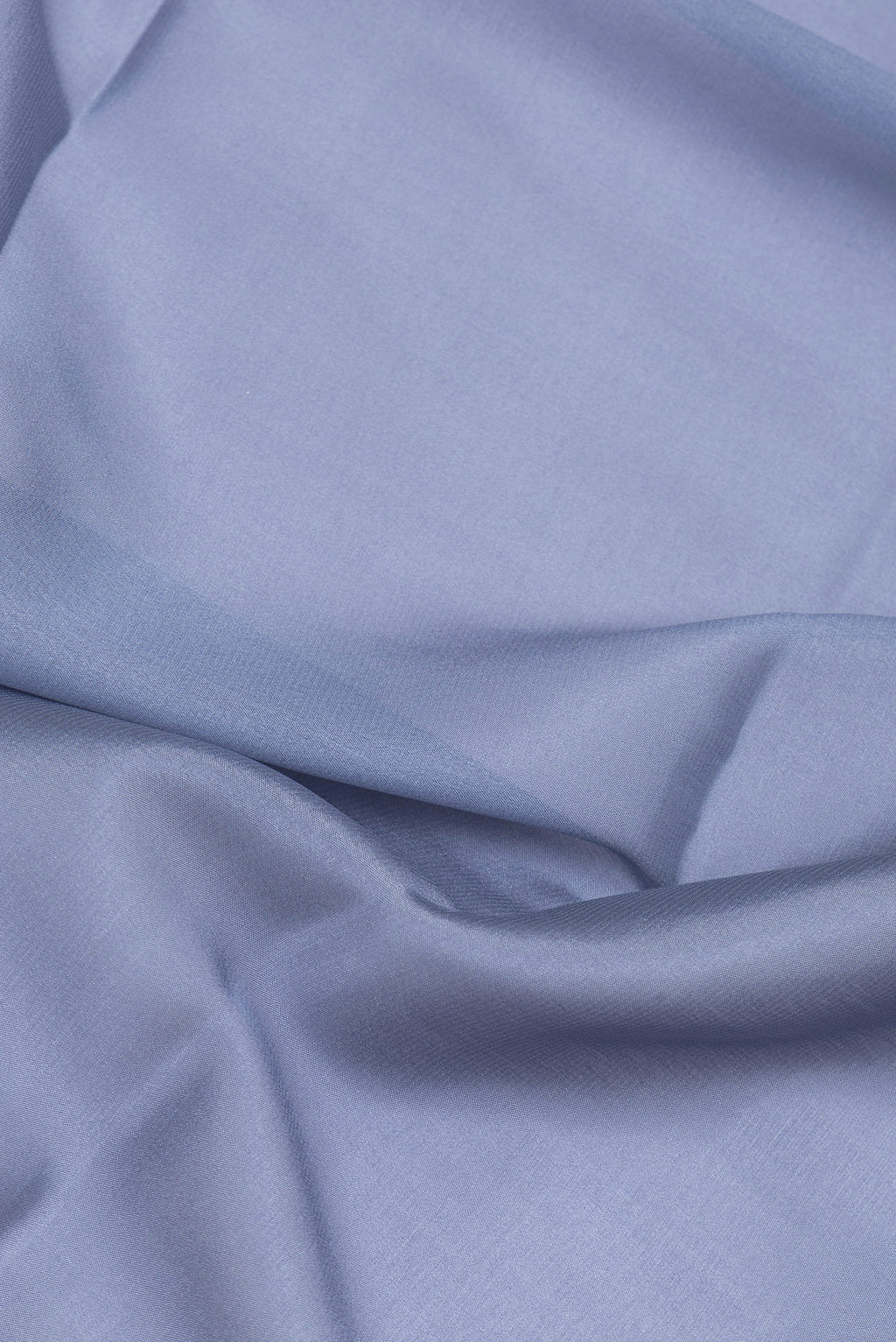 Close up of Grey Mysore Crepe Saree with Plain Body and Zari Border.  displaying folds
