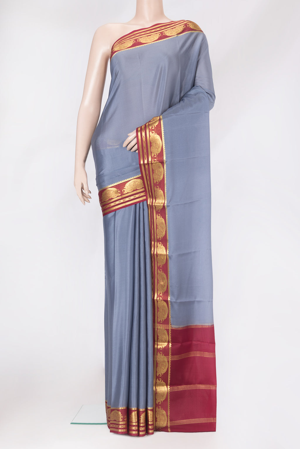 Grey Mysore Crepe Saree with Plain Body and Zari Border.  displayed on a mannequin