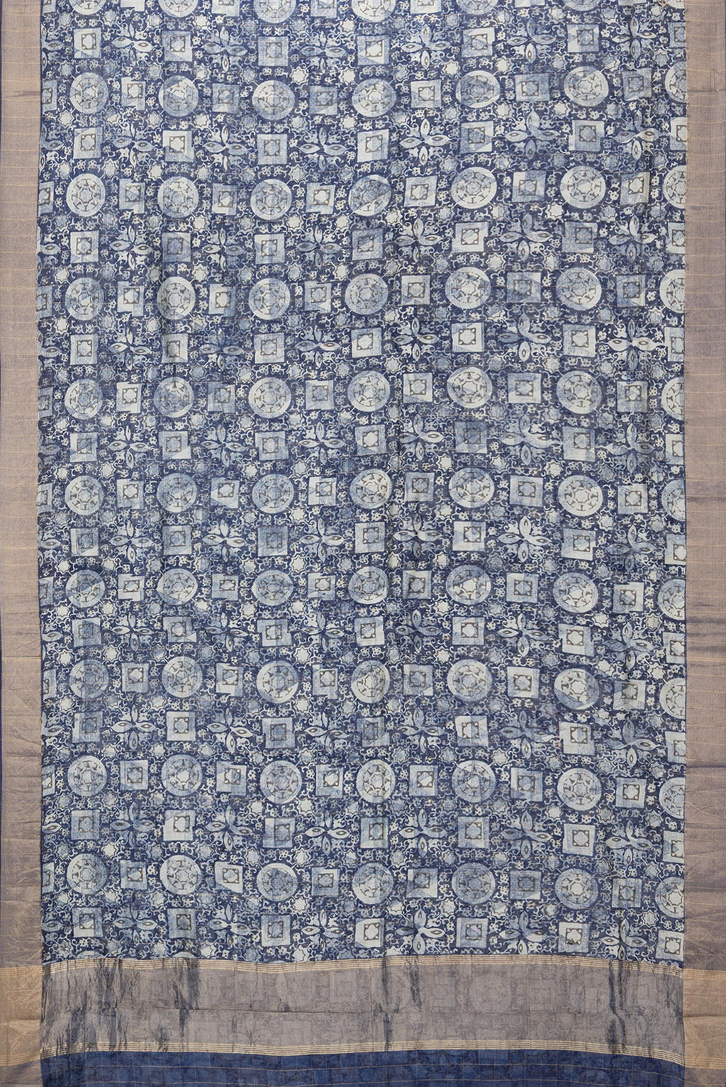 Flat view of Navy Blue Dual Tone Chanderi Silk Saree with Printed design on the body and Zari Border. 