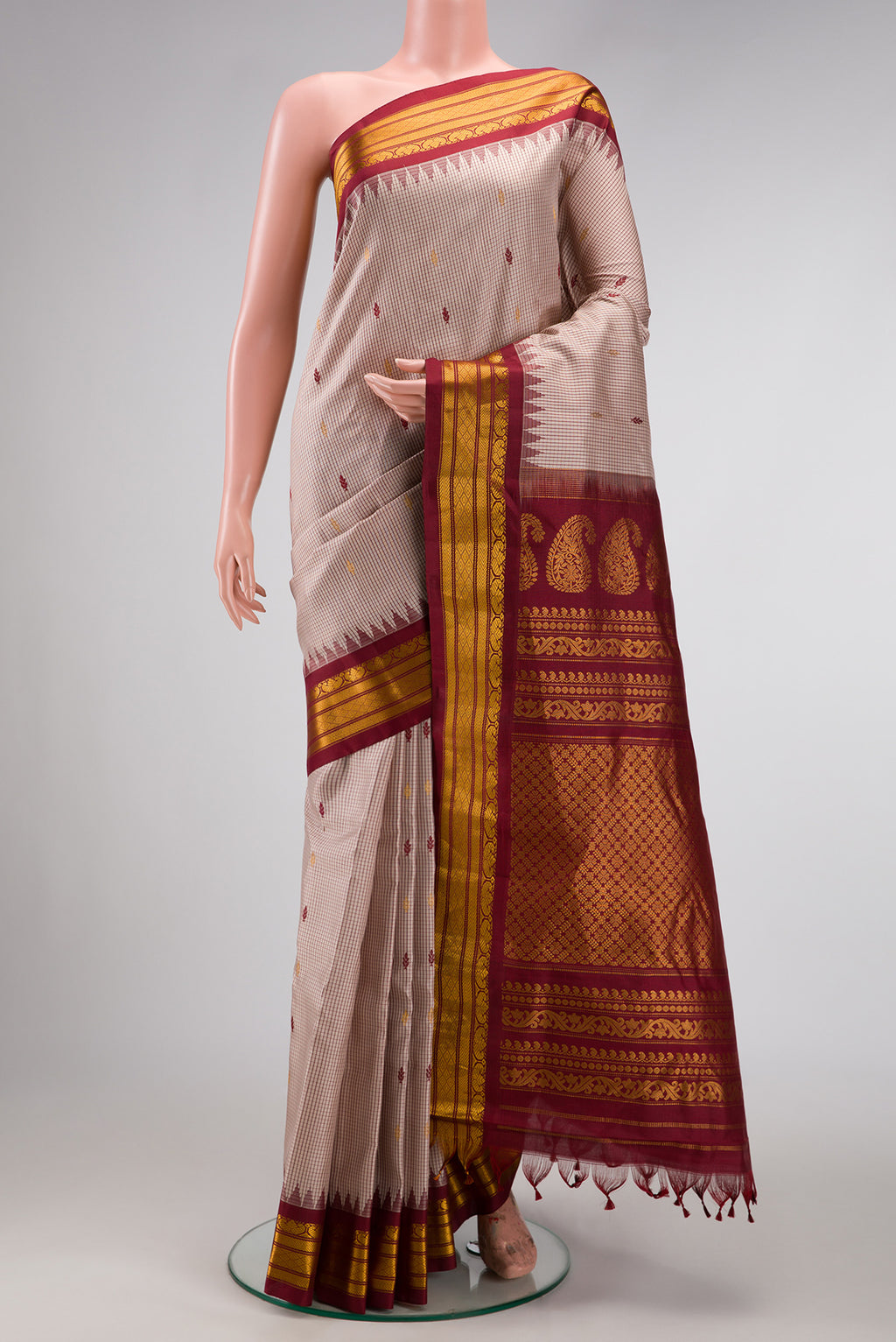 Dark Beige Dual Tone Gadwal Silk Saree with Zari And Thread Butta on the body and Zari Border.  displayed on a mannequin