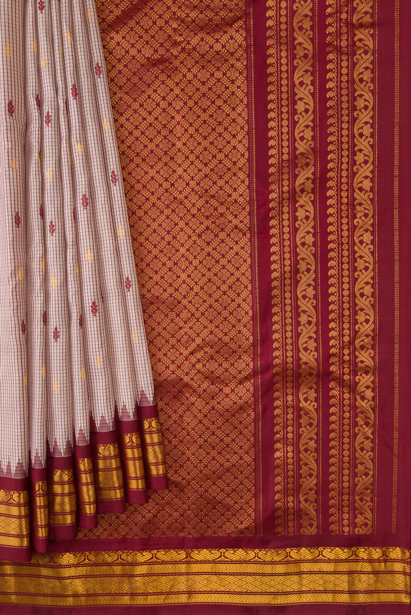 Pleats and pallu of Dark Beige Dual Tone Gadwal Silk Saree with Zari And Thread Butta on the body and Zari Border. 