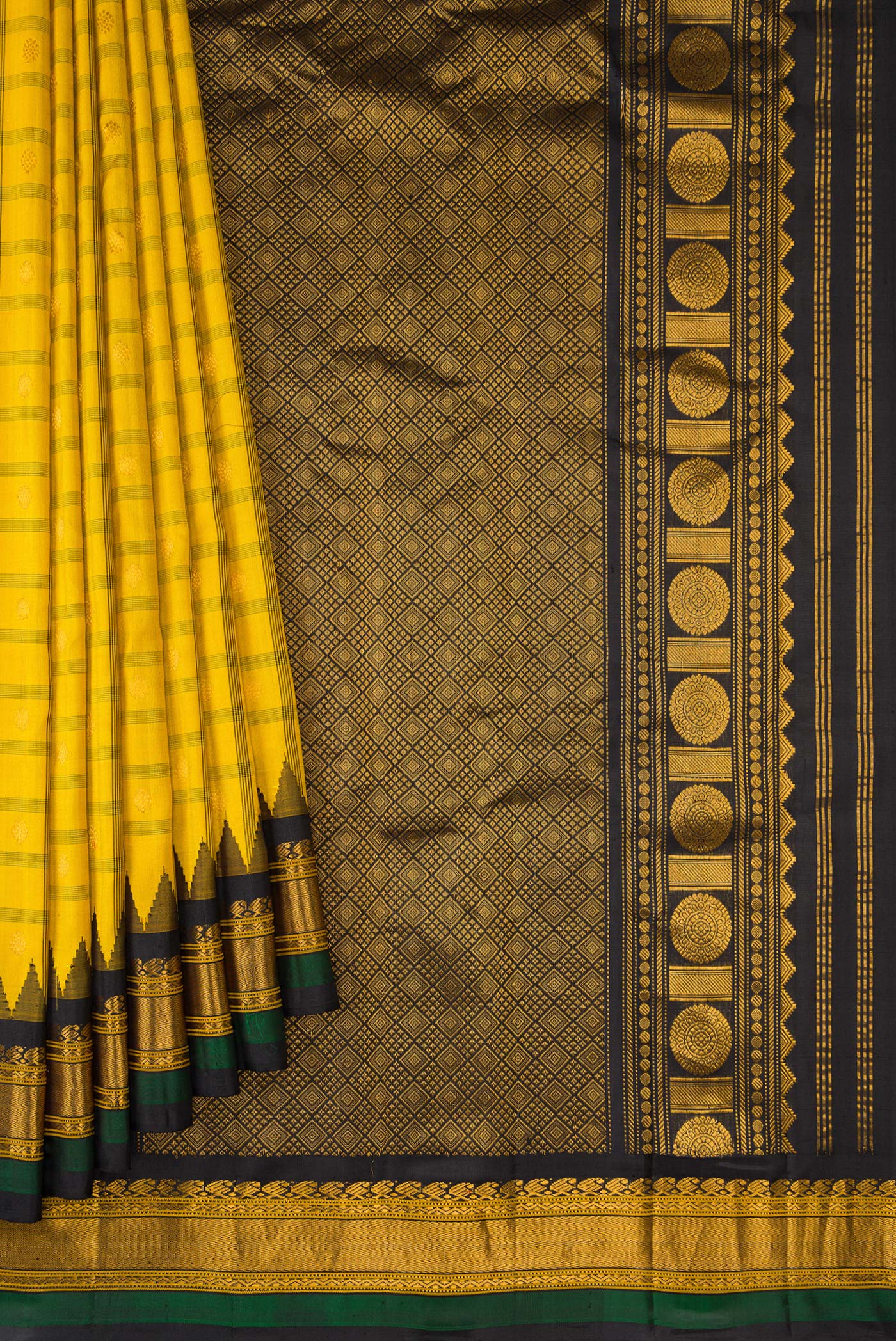 Pleats and pallu of Yellow Dual Tone Gadwal Silk Saree with Checked design on the body and Temple Border. 