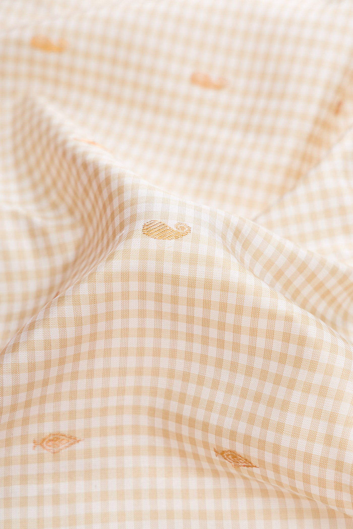 Close up of Off White Dual Tone Gadwal Silk Saree with Zari Butta on the body and Zari Border.  displaying folds