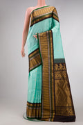 Sky Blue Dual Tone Gadwal Silk Saree with Zari Butta on the body and Zari Border.  displayed on a mannequin