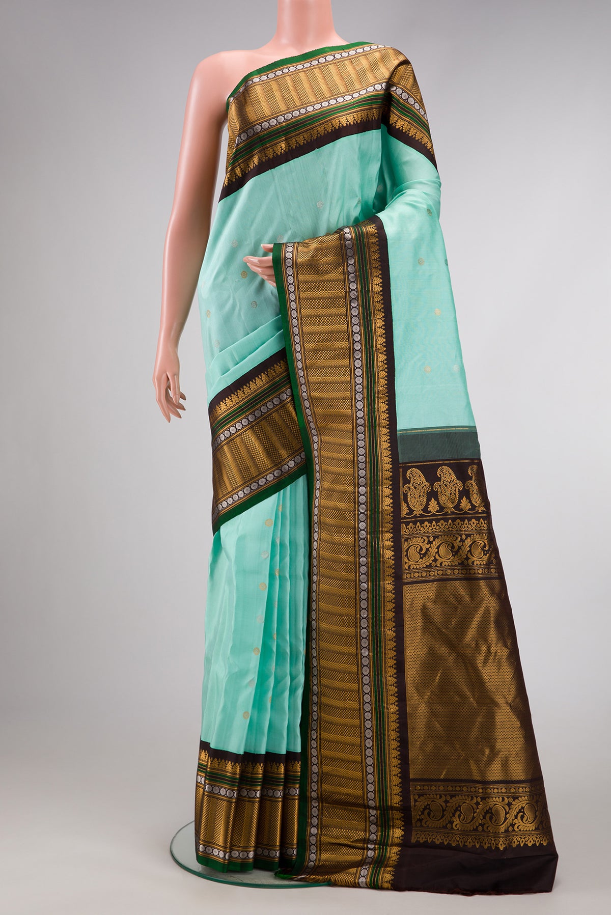 Sky Blue Dual Tone Gadwal Silk Saree with Zari Butta on the body and Zari Border.  displayed on a mannequin