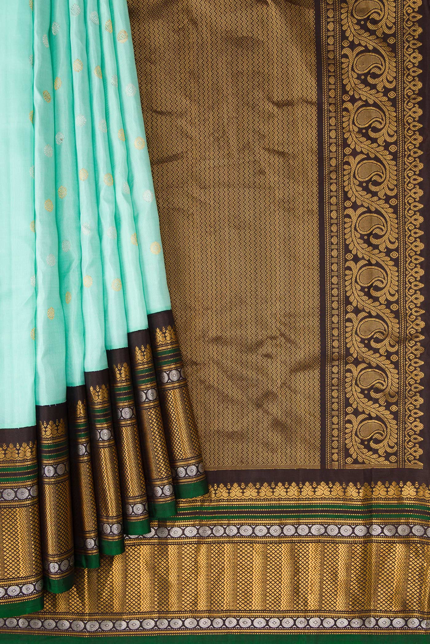 Pleats and pallu of Sky Blue Dual Tone Gadwal Silk Saree with Zari Butta on the body and Zari Border. 
