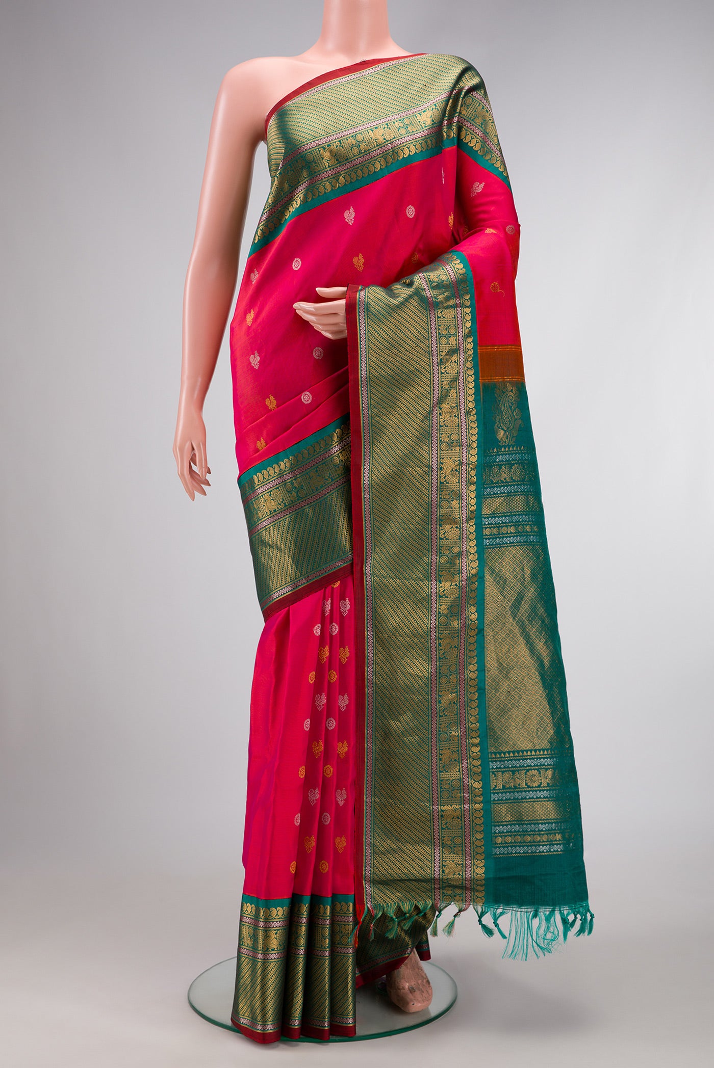 Coral Dual Tone Gadwal Silk Saree with Zari Butta on the body and Zari Border.  displayed on a mannequin