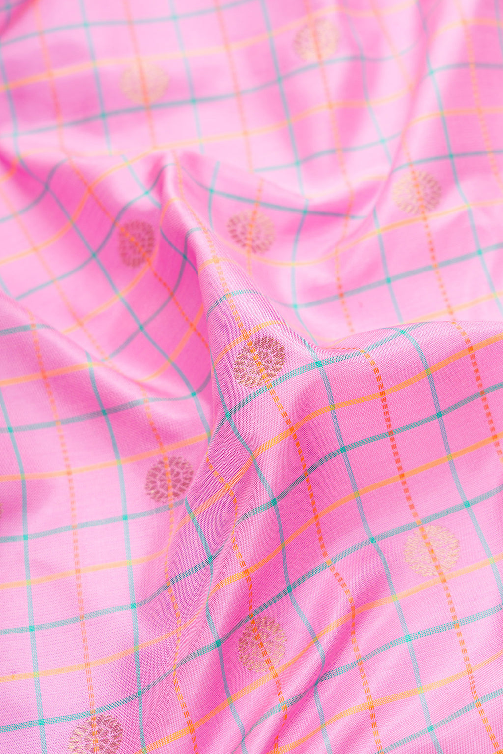 Close up of Pink Dual Tone Gadwal Silk Saree with Checked design on the body and Temple Border.  displaying folds