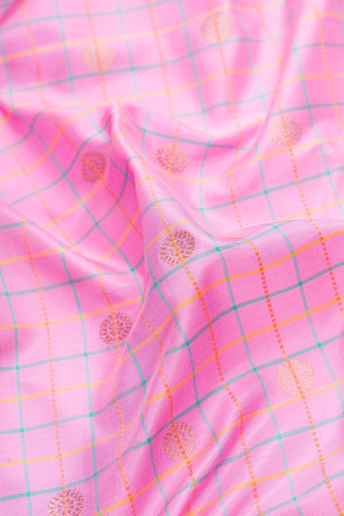 Close up of Pink Dual Tone Gadwal Silk Saree with Checked design on the body and Temple Border.  displaying folds