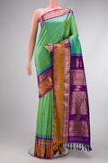 Light Green Dual Tone Gadwal Silk Saree with Zari Butta on the body and Zari Border.  displayed on a mannequin