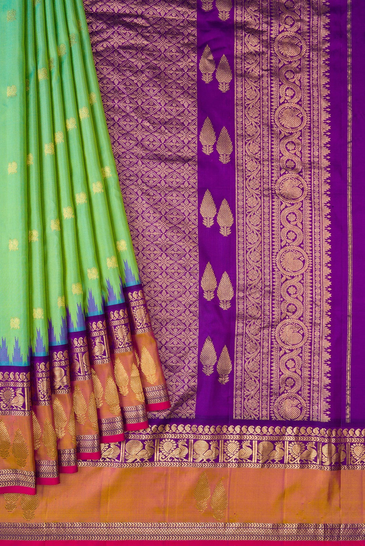 Pleats and pallu of Light Green Dual Tone Gadwal Silk Saree with Zari Butta on the body and Zari Border. 