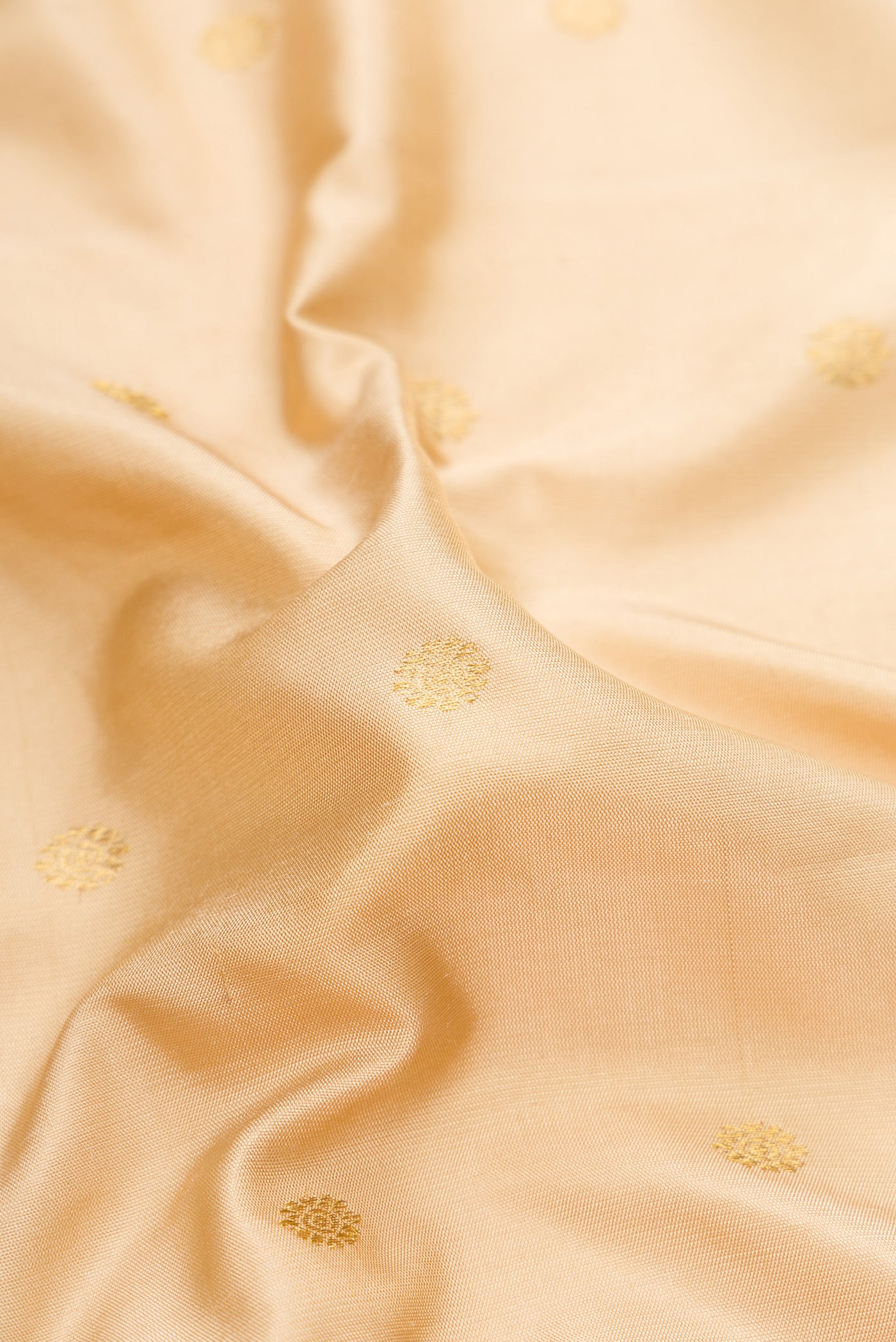 Close up of Dark Beige Gadwal Silk Saree with Zari Butta on the body and Zari Border.  displaying folds
