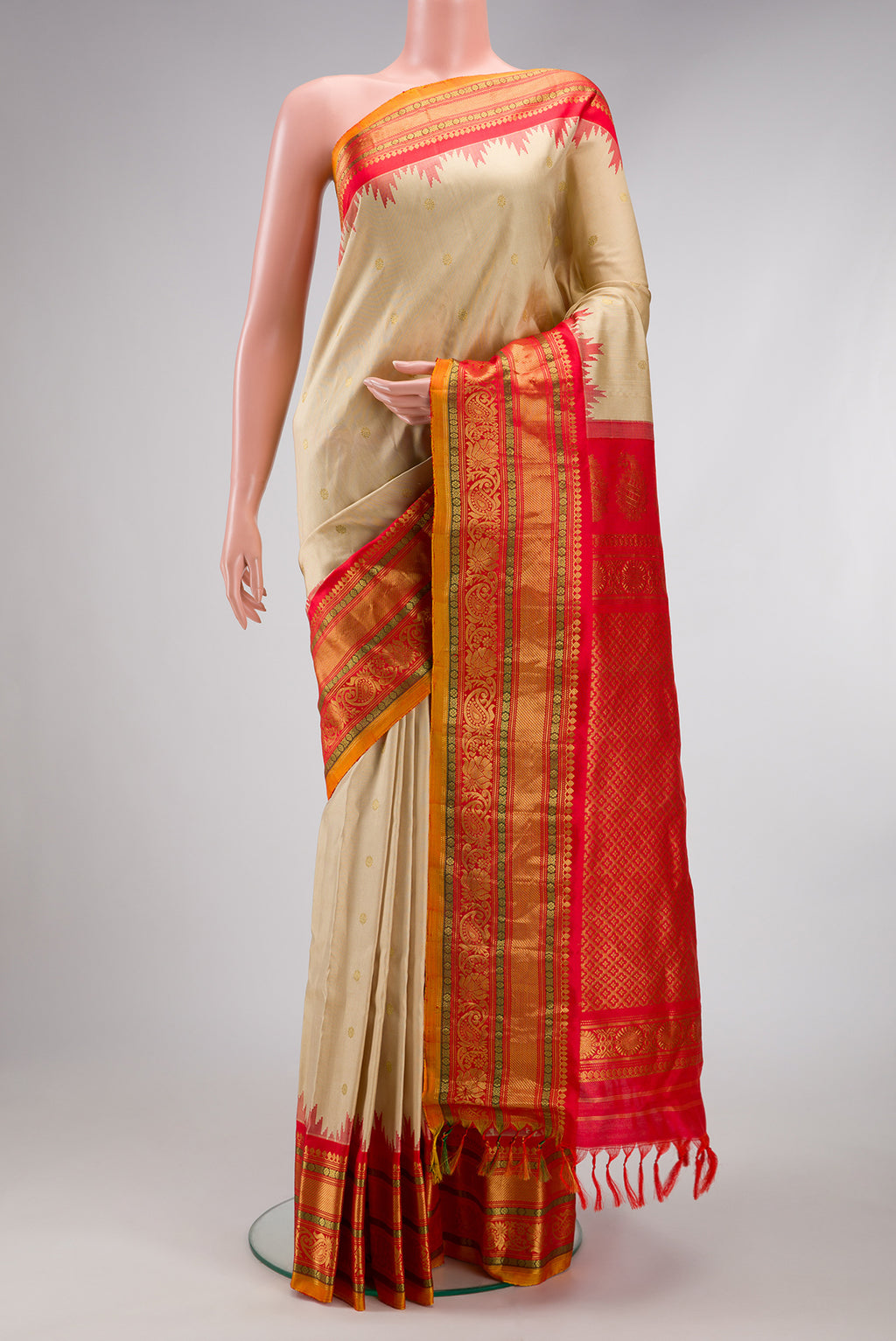 Dark Beige Gadwal Silk Saree with Zari Butta on the body and Zari Border.  displayed on a mannequin