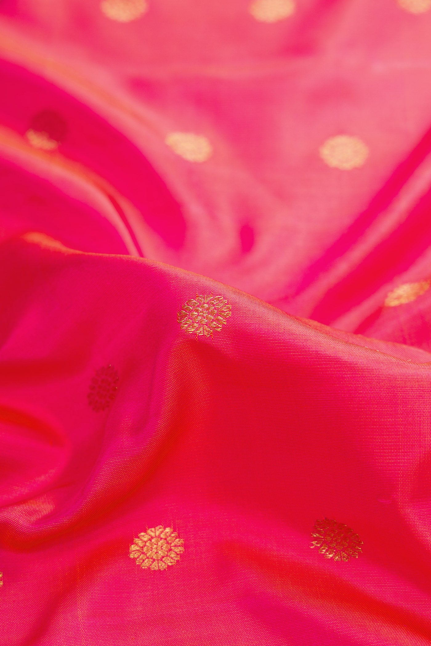 Close up of Pink Dual Tone Gadwal Silk Saree with Zari Butta on the body and Zari Border.  displaying folds