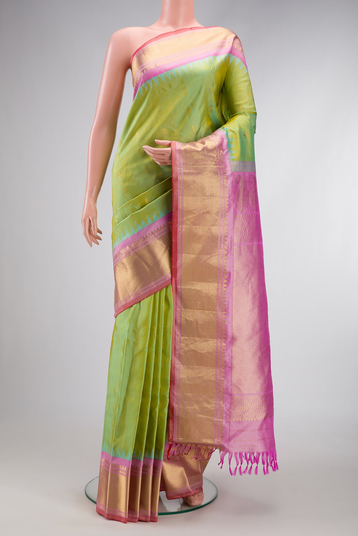 Light Green Dual Tone Gadwal Silk Saree with Zari Butta on the body and Zari Border.  displayed on a mannequin