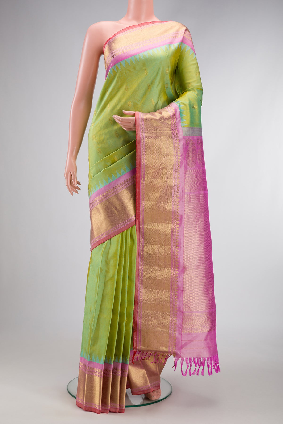 Light Green Dual Tone Gadwal Silk Saree with Zari Butta on the body and Zari Border.  displayed on a mannequin