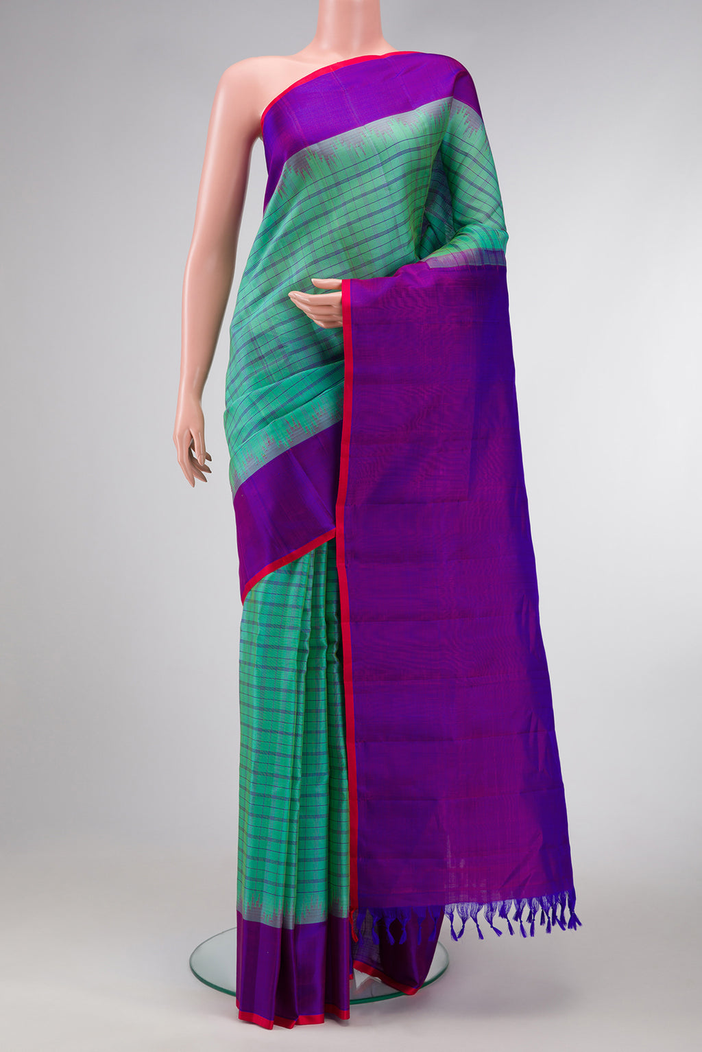 Sea Green Dual Tone Gadwal Silk Saree with Checked design on the body and Temple Border.  displayed on a mannequin