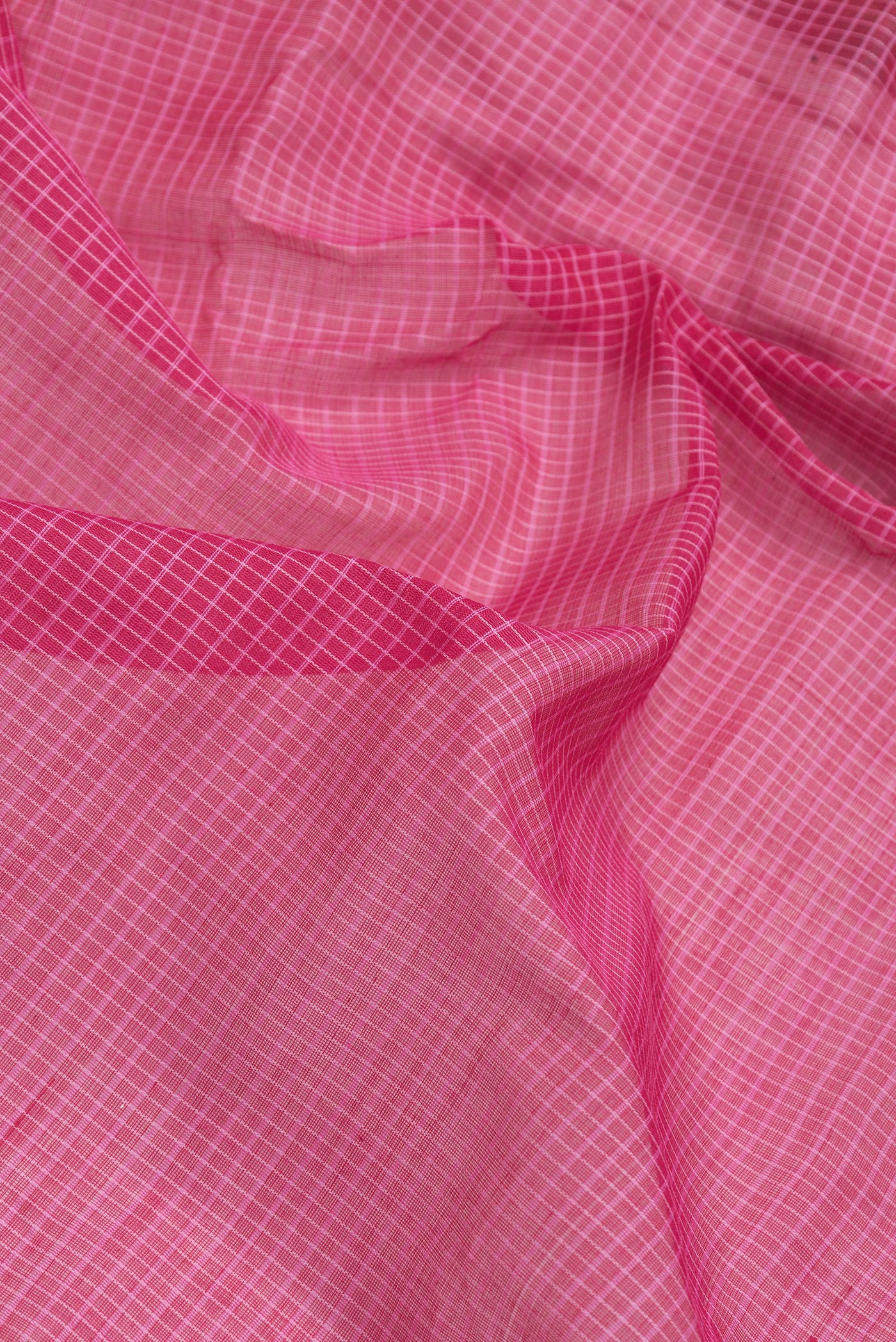Close up of Pink Dual Tone Gadwal cotton Saree with Checked design on the body and Zari Border.  displaying folds