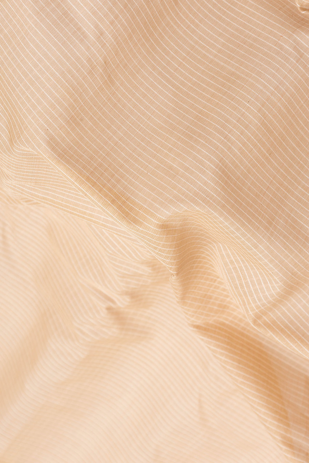 Close up of Beige Dual Tone Gadwal Silk Saree with Checked design on the body and Zari Border.  displaying folds