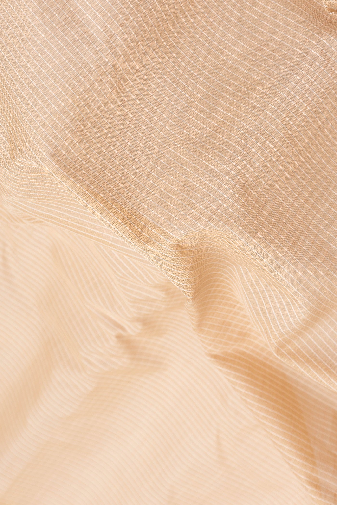 Close up of Beige Dual Tone Gadwal Silk Saree with Checked design on the body and Zari Border.  displaying folds