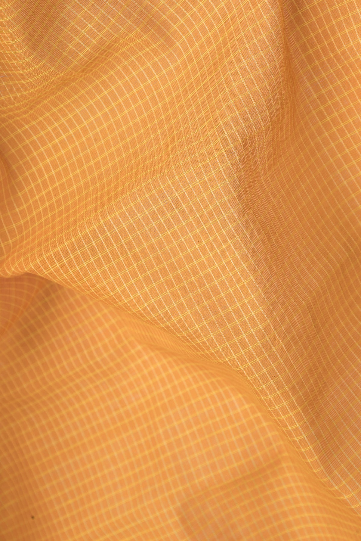 Close up of Yellow Dual Tone Gadwal cotton Saree with Checked design on the body and Zari Border.  displaying folds