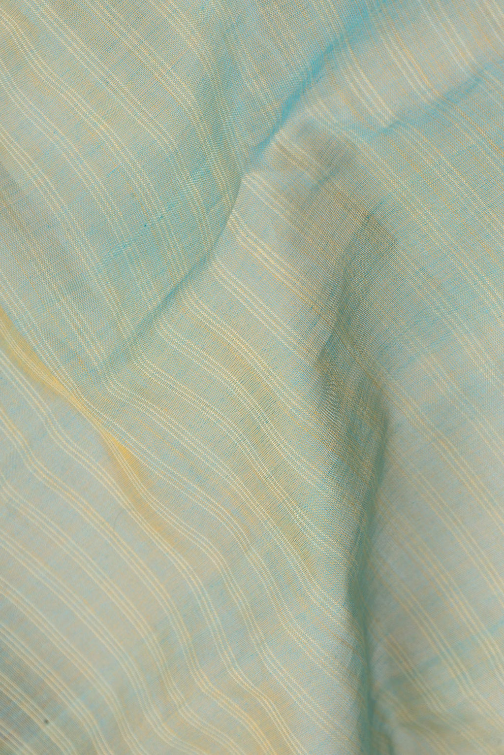 Close up of Pista Green Dual Tone Gadwal cotton Saree with Stripes on the body and Zari Border.  displaying folds