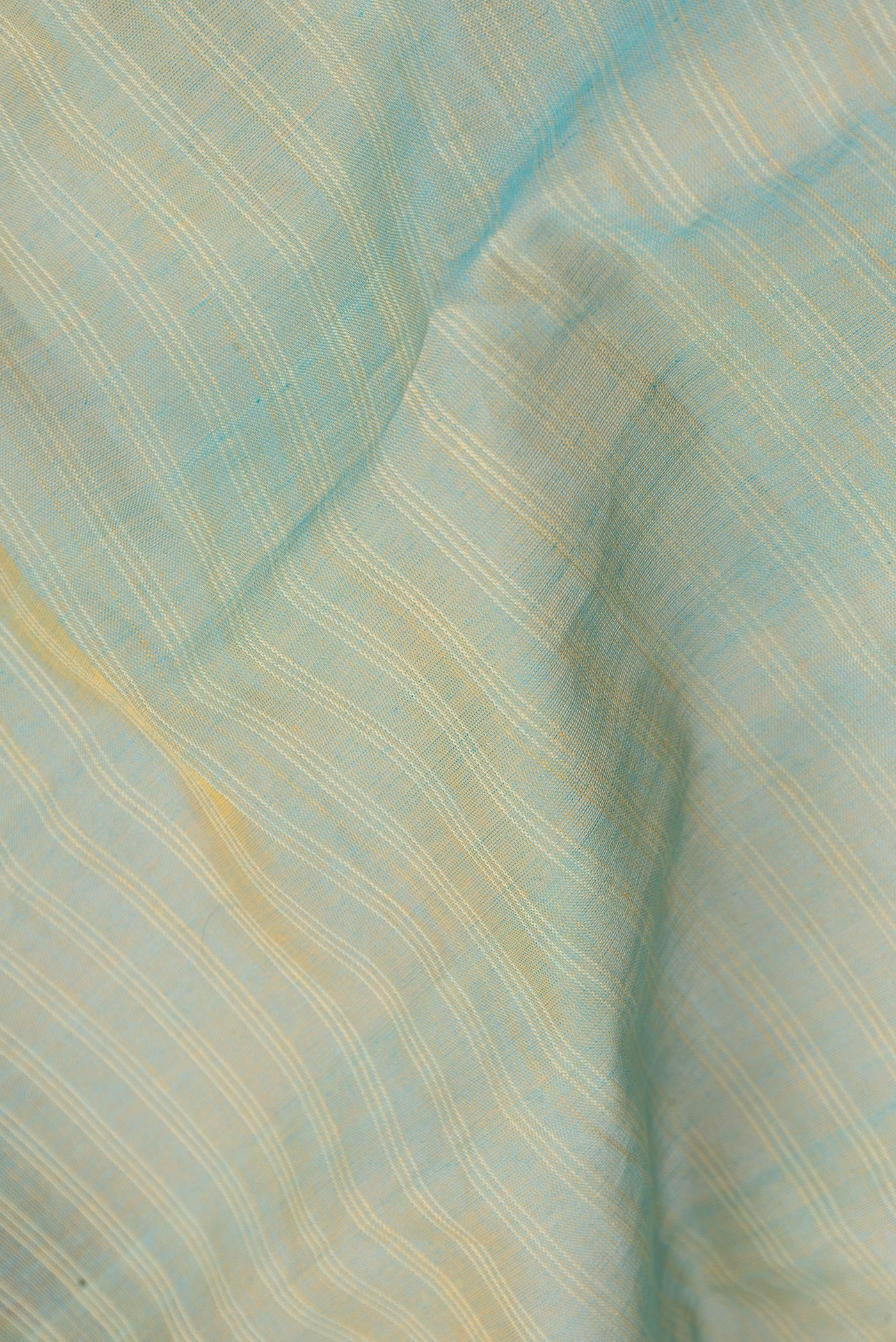 Close up of Pista Green Dual Tone Gadwal cotton Saree with Stripes on the body and Zari Border.  displaying folds