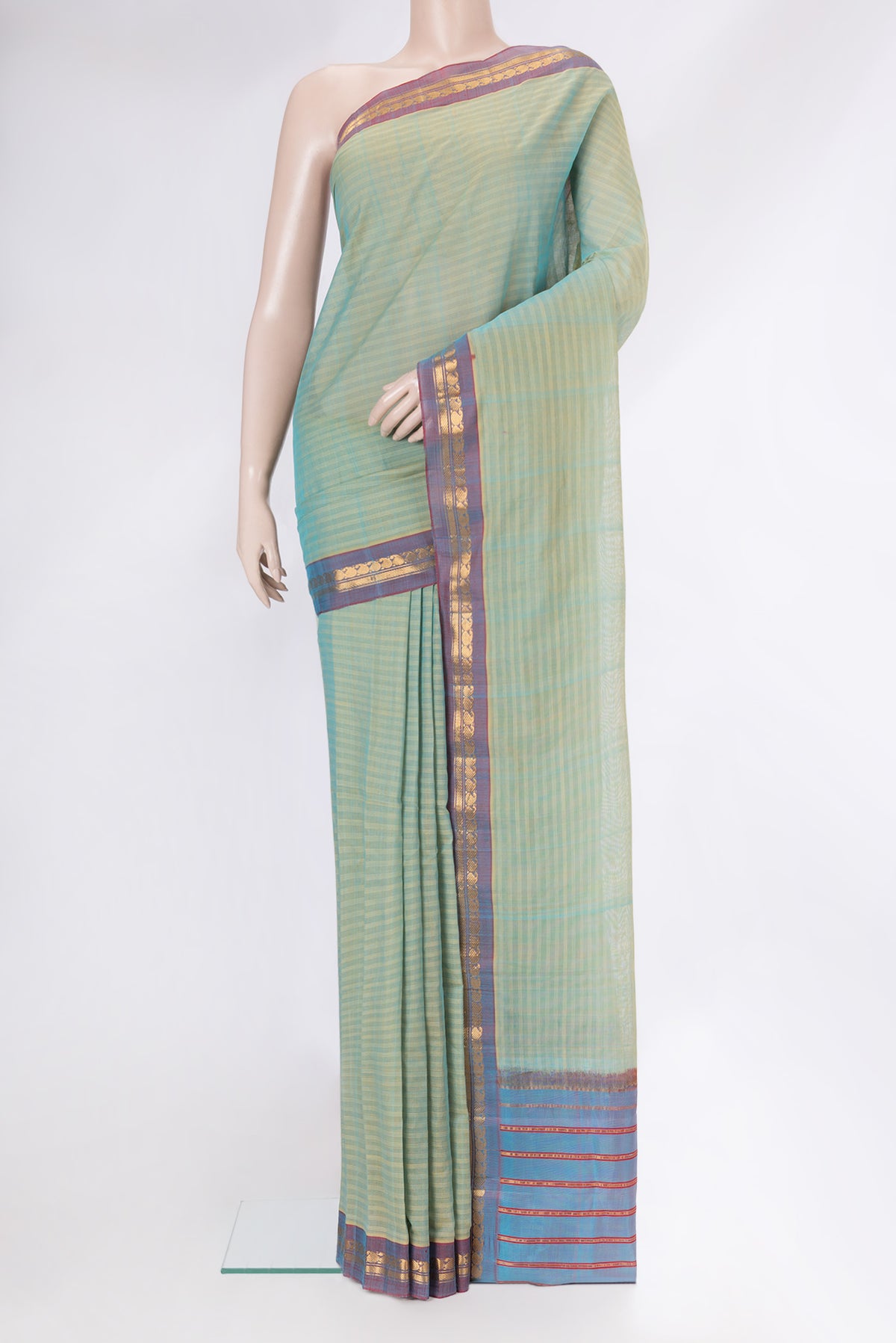 Pista Green Dual Tone Gadwal cotton Saree with Stripes on the body and Zari Border.  displayed on a mannequin