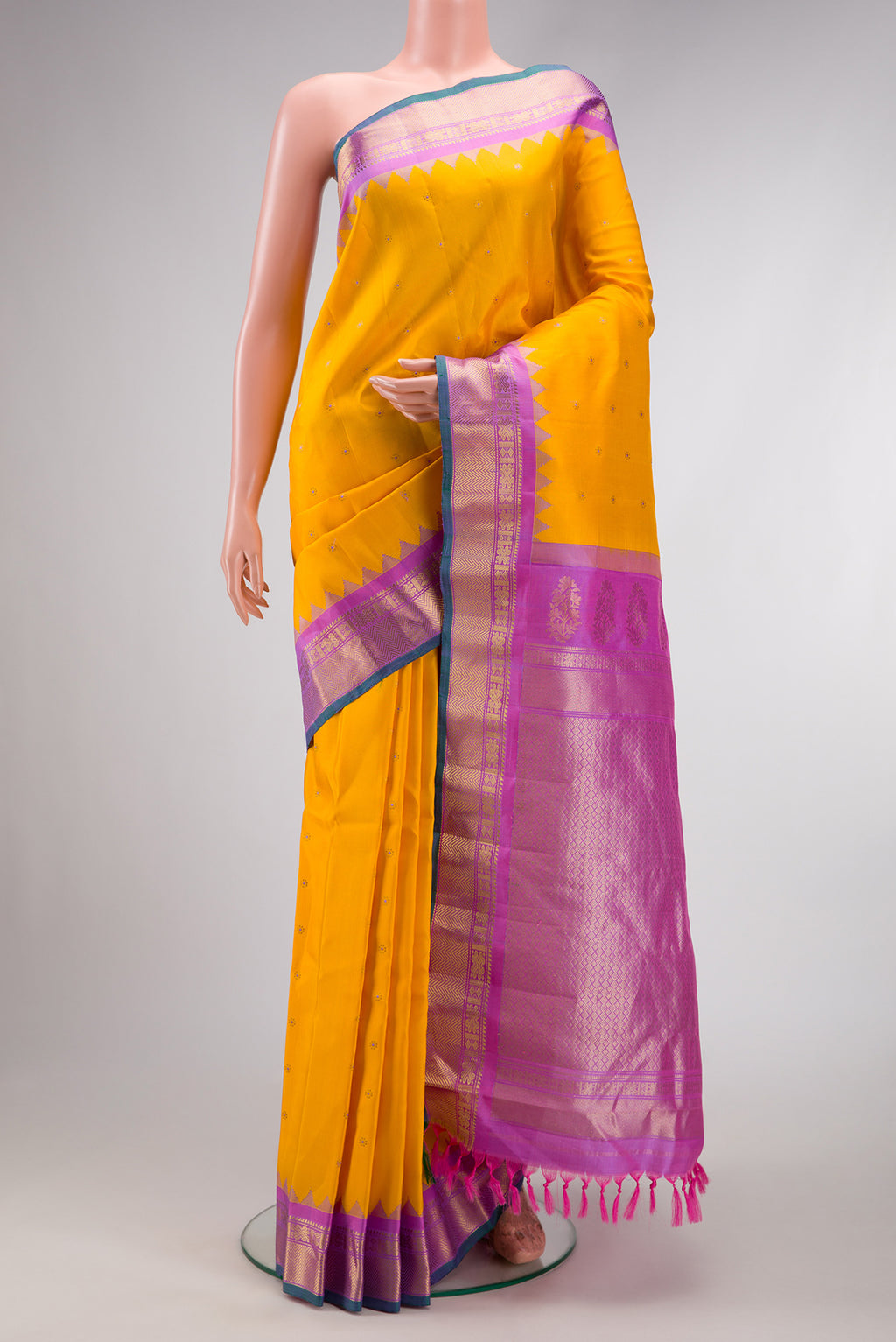 Mustard Dual Tone Gadwal Silk Saree with Zari Butta on the body and Zari Border.  displayed on a mannequin