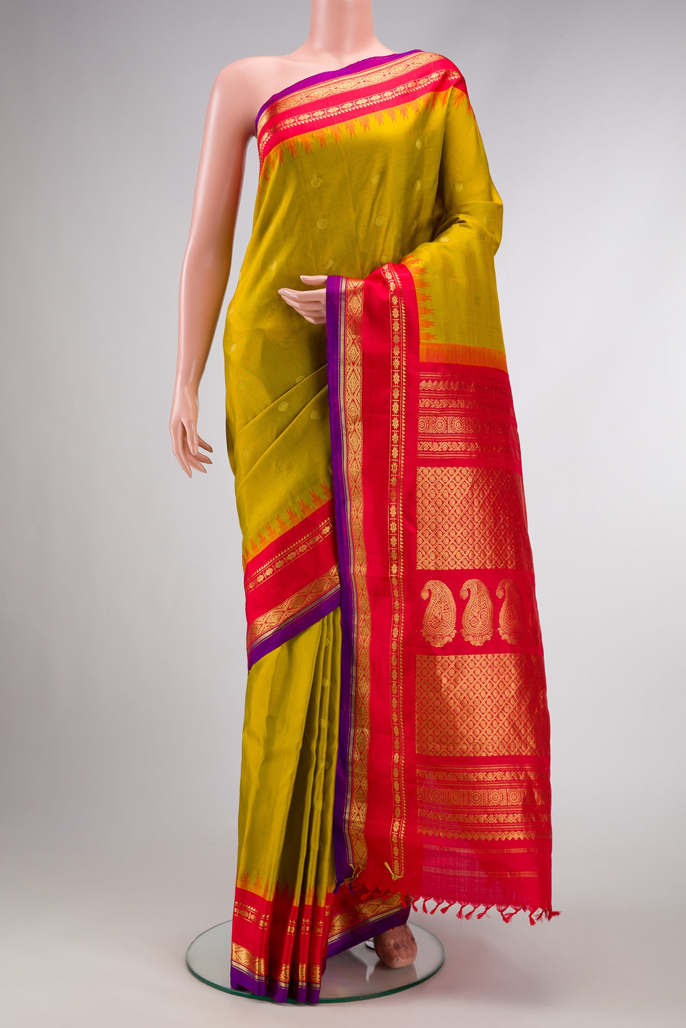 Mehandi Green Dual Tone Gadwal Silk Saree with Zari Butta on the body and Zari Border.  displayed on a mannequin